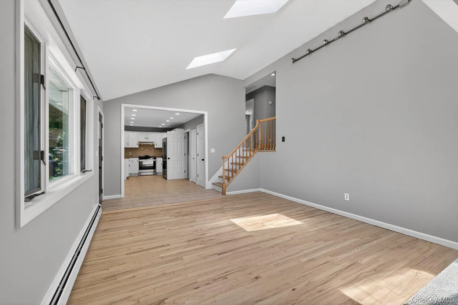 Living Room Spills Seamlessly Into Dining Area and Kitchen Living Room Spills Seamlessly Into Dining Area and Kitchen