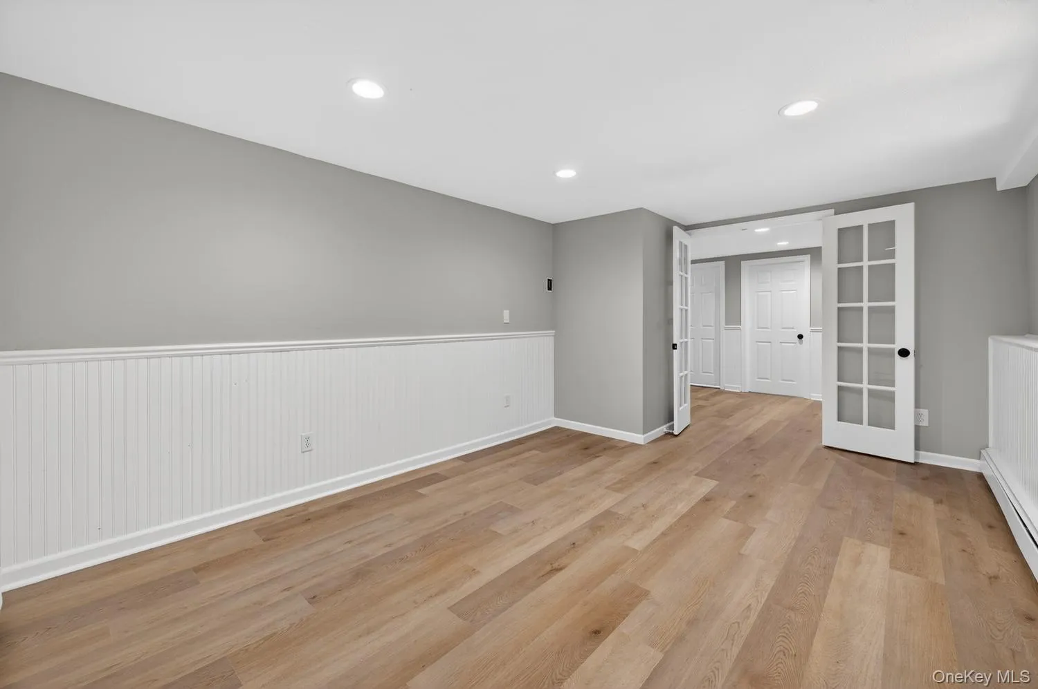 Primary is Tucked Behind French Doors and Offers Brand New Luxury Vinyl Flooring Primary is Tucked Behind French Doors and Offers Brand New Luxury Vinyl Flooring