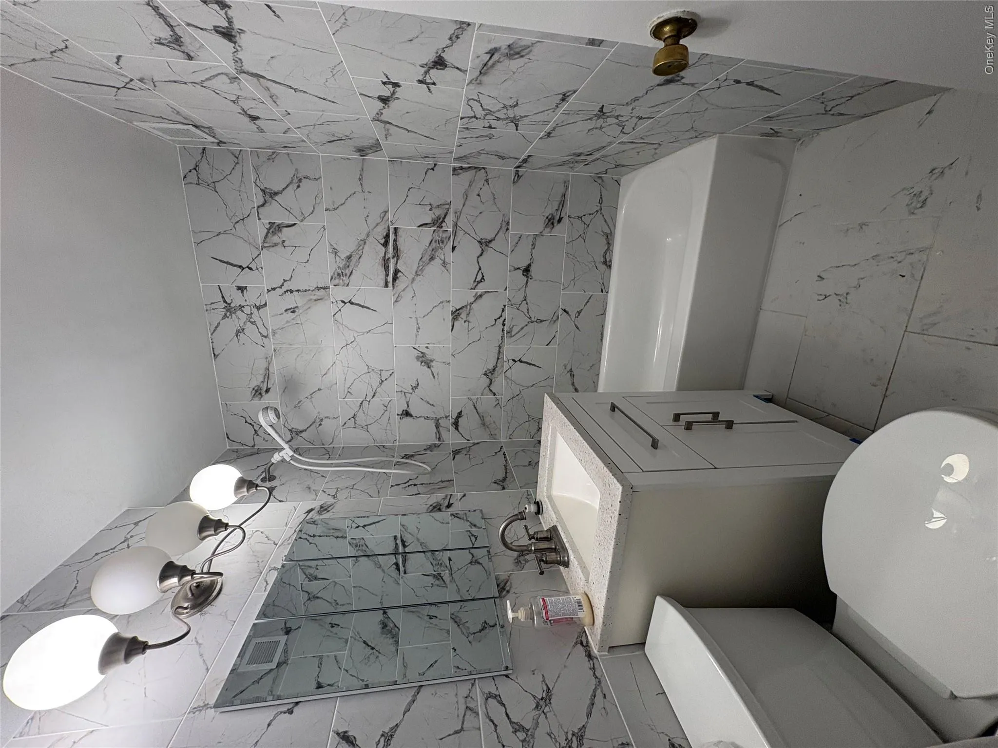 Full Tiled Renovated Bathroom. Full Tiled Renovated Bathroom.