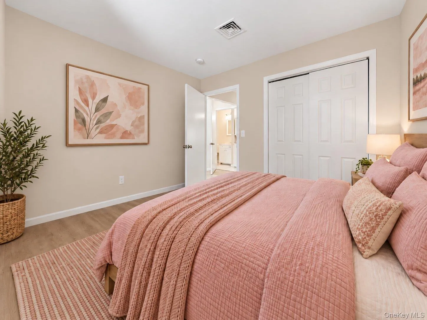 Virtually Staged. Alternate view of the bedroom showing a double-door closet and easy access to the nearby bathroom. Virtually Staged. Alternate view of the bedroom showing a double-door closet and easy access to the nearby bathroom.