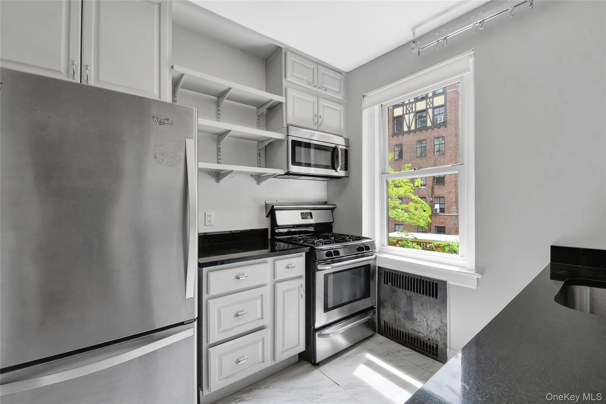 Kitchen with a stunning courtyard view. Kitchen with a stunning courtyard view.