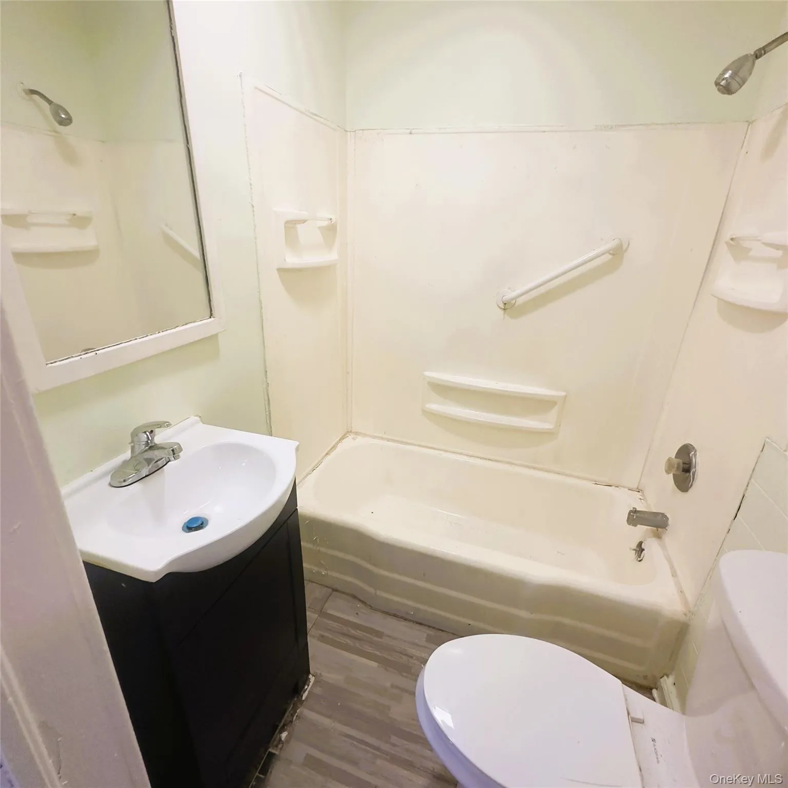 Vinyl flooring, tub and shower, vanity sink, toilet, electric heat. Vinyl flooring, tub and shower, vanity sink, toilet, electric heat.