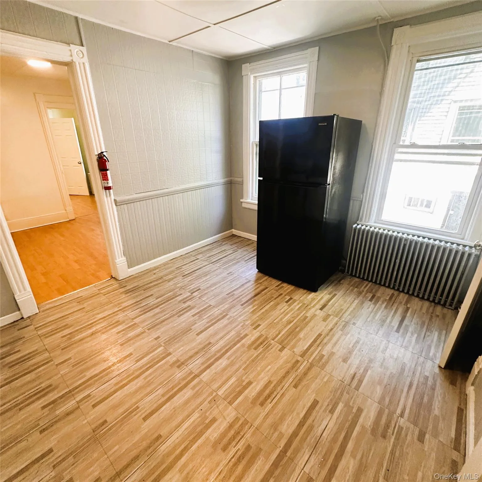 Vinyl flooring, radiator, light fixture, refrigerator. Vinyl flooring, radiator, light fixture, refrigerator.