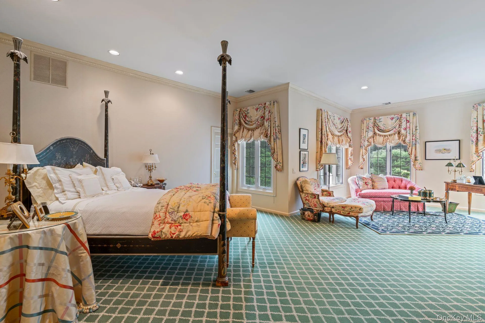 Primary Bedroom is a luxurious retreat with spacious sitting room overlooking pristine property, dressing area, two large walk-in closets and lavish spa bath Primary Bedroom is a luxurious retreat with spacious sitting room overlooking pristine property, dressing area, two large walk-in closets and lavish spa bath