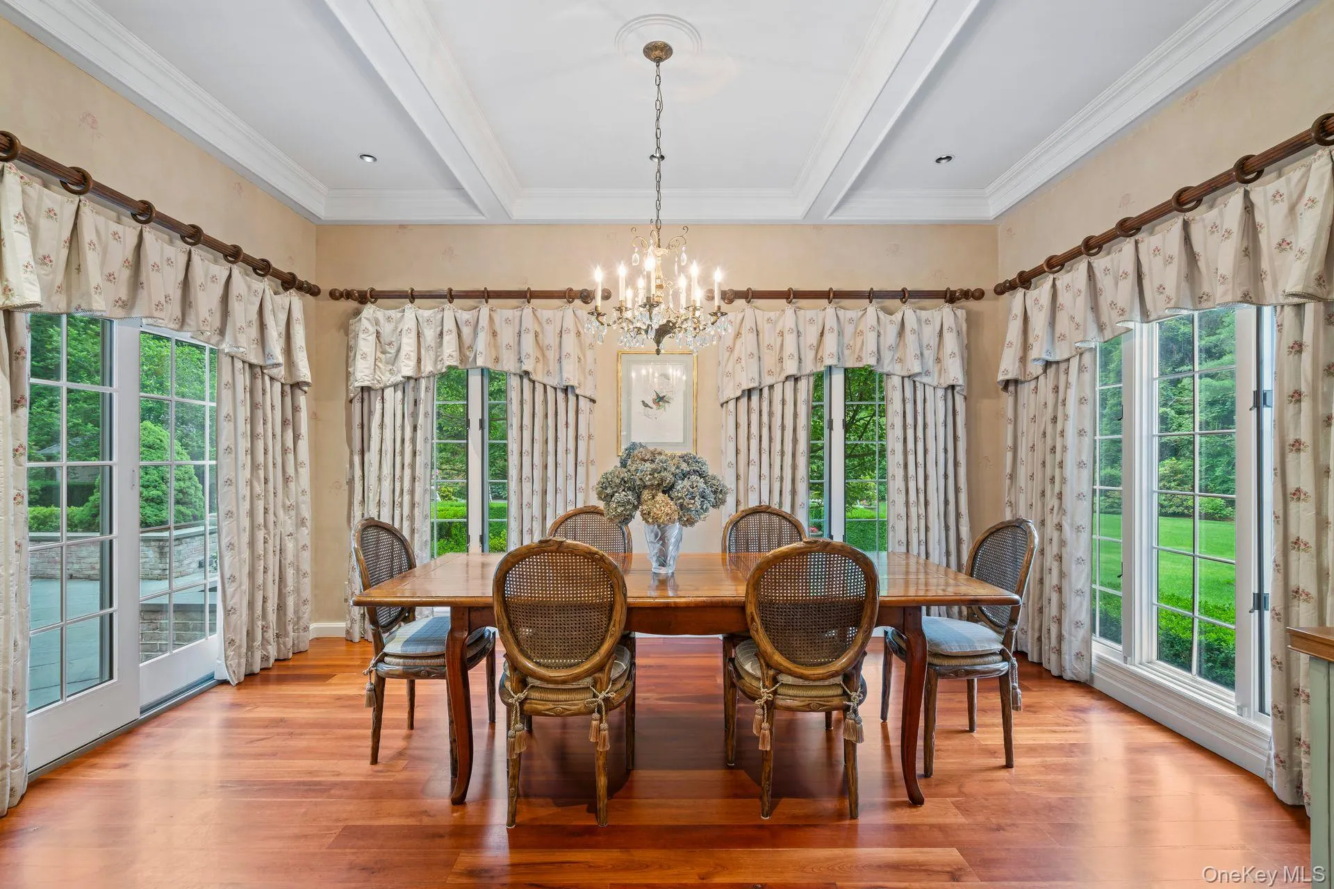 Breakfast room w natural light, cherrywood finished floors, beam ceiling, and crown molding, french sliding door to patio Breakfast room w natural light, cherrywood finished floors, beam ceiling, and crown molding, french sliding door to patio