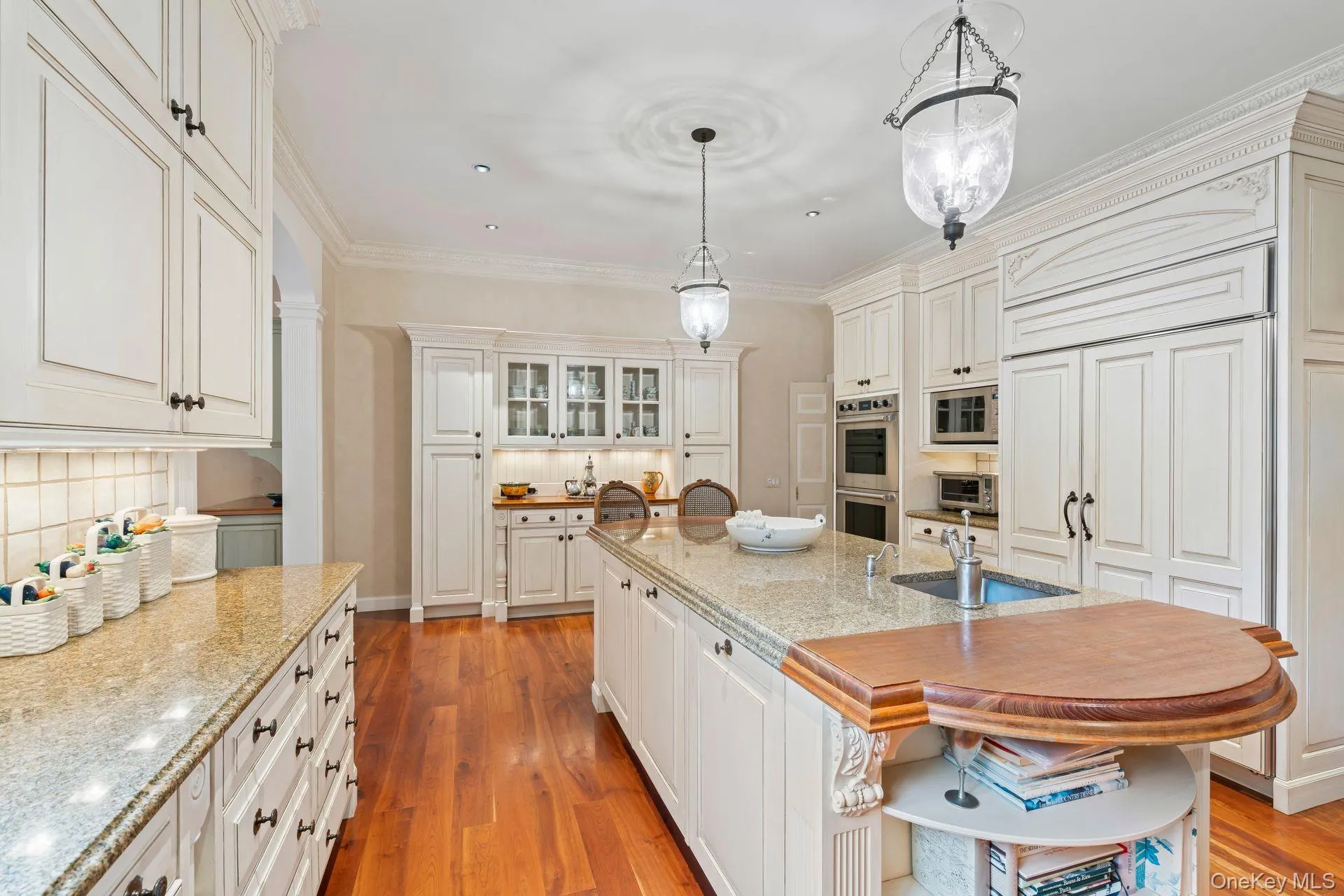 Abundance of custom cabinetry, cherrywood floors, ornamental molding Abundance of custom cabinetry, cherrywood floors, ornamental molding
