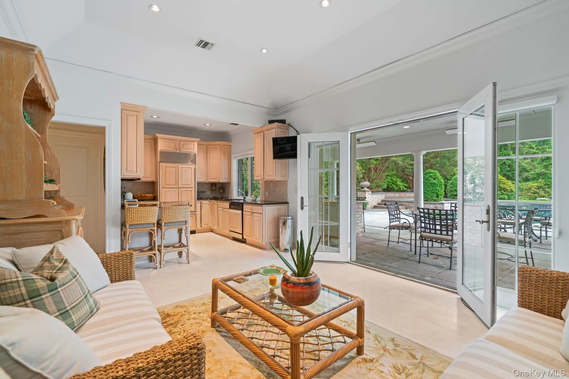 Full Kitchen and Living area with light tile floors, and recessed lighting Full Kitchen and Living area with light tile floors, and recessed lighting