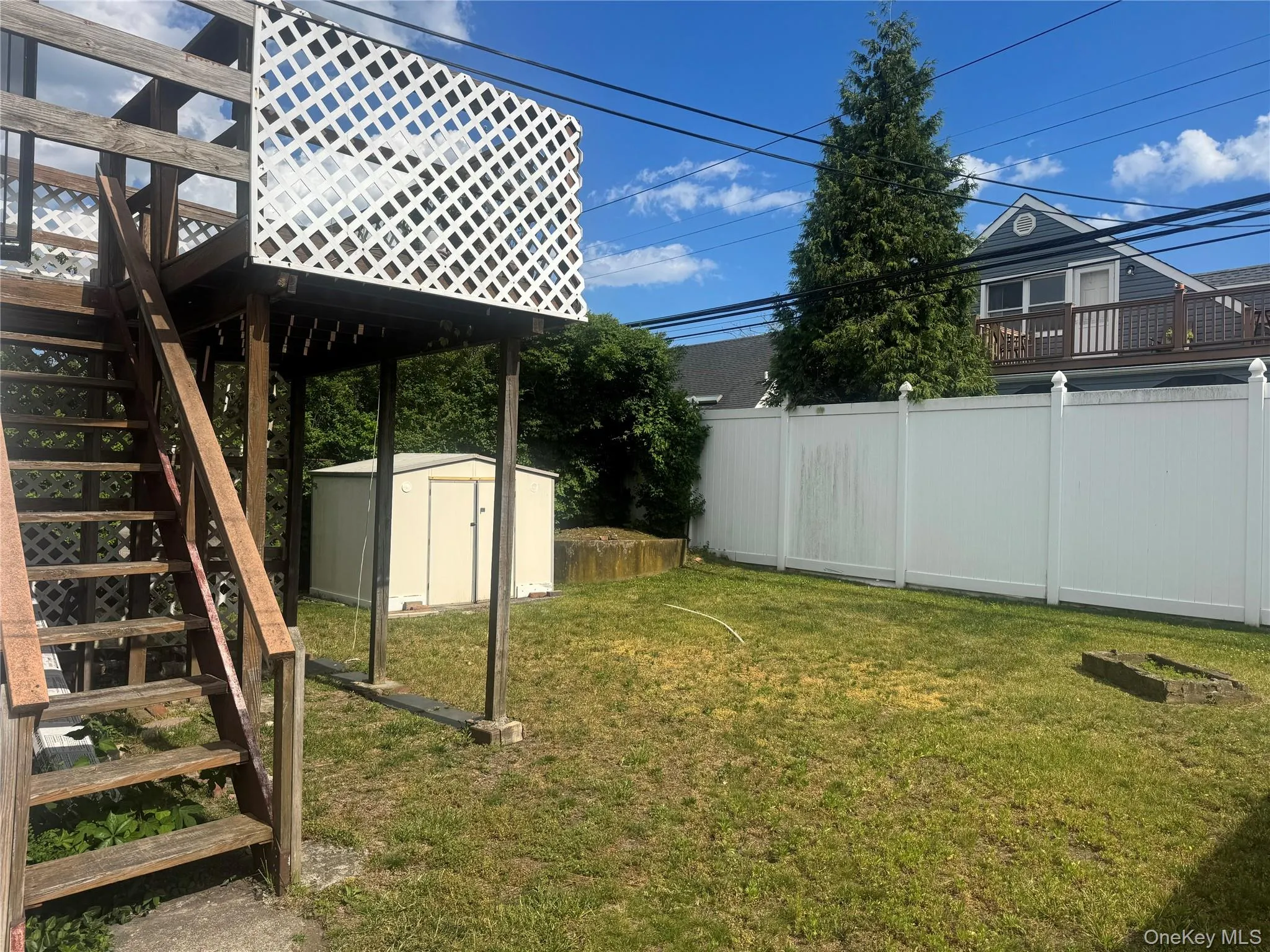 Balcony to fenced backyard Balcony to fenced backyard