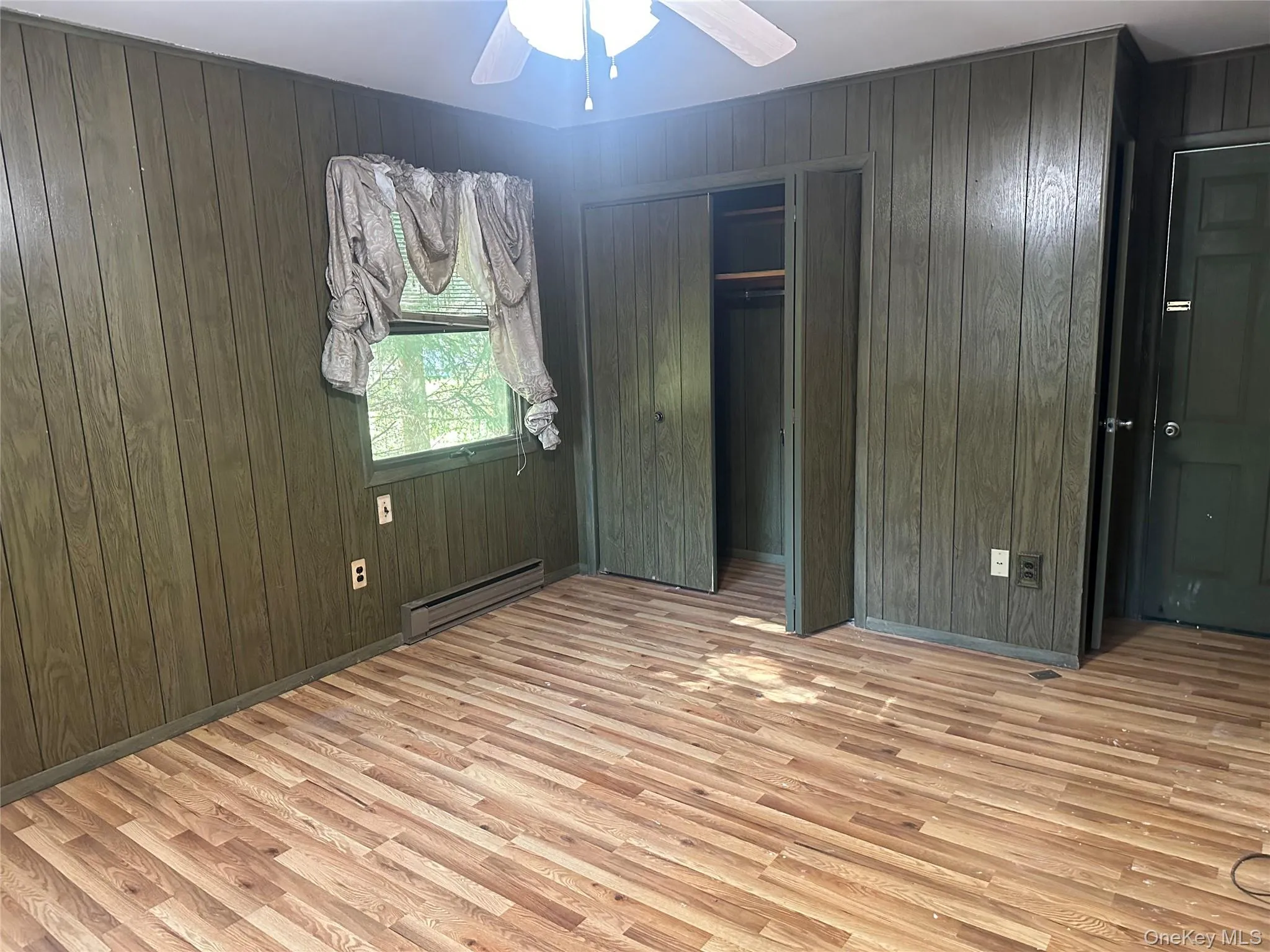 Wood-finish flooring with vertical paneled walls Wood-finish flooring with vertical paneled walls