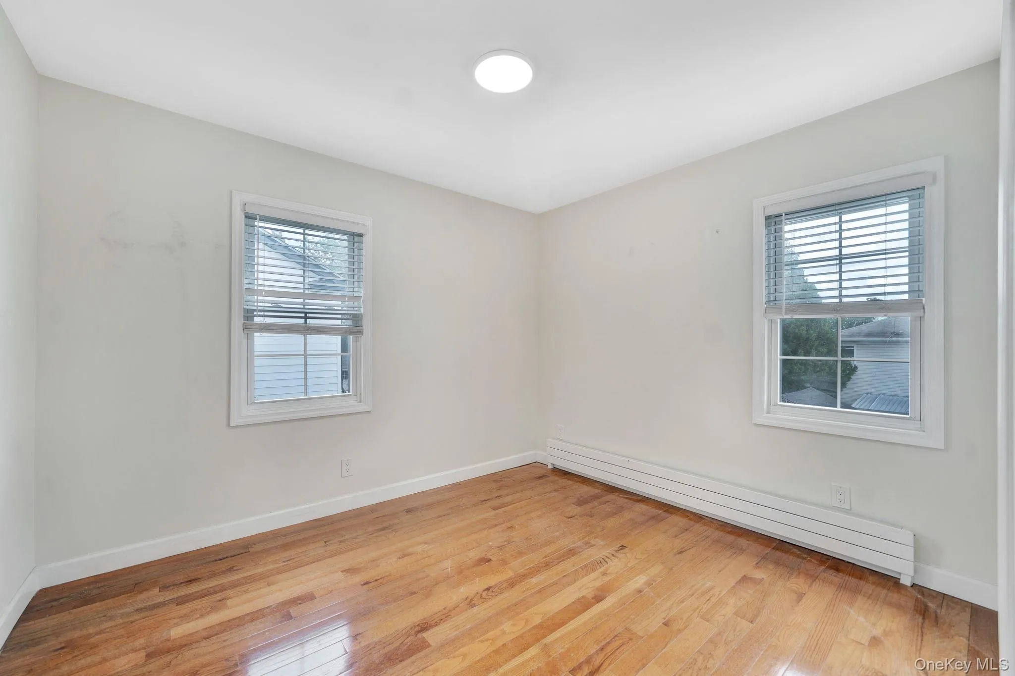 1st bedroom on 2nd floor with windows. 1st bedroom on 2nd floor with windows.