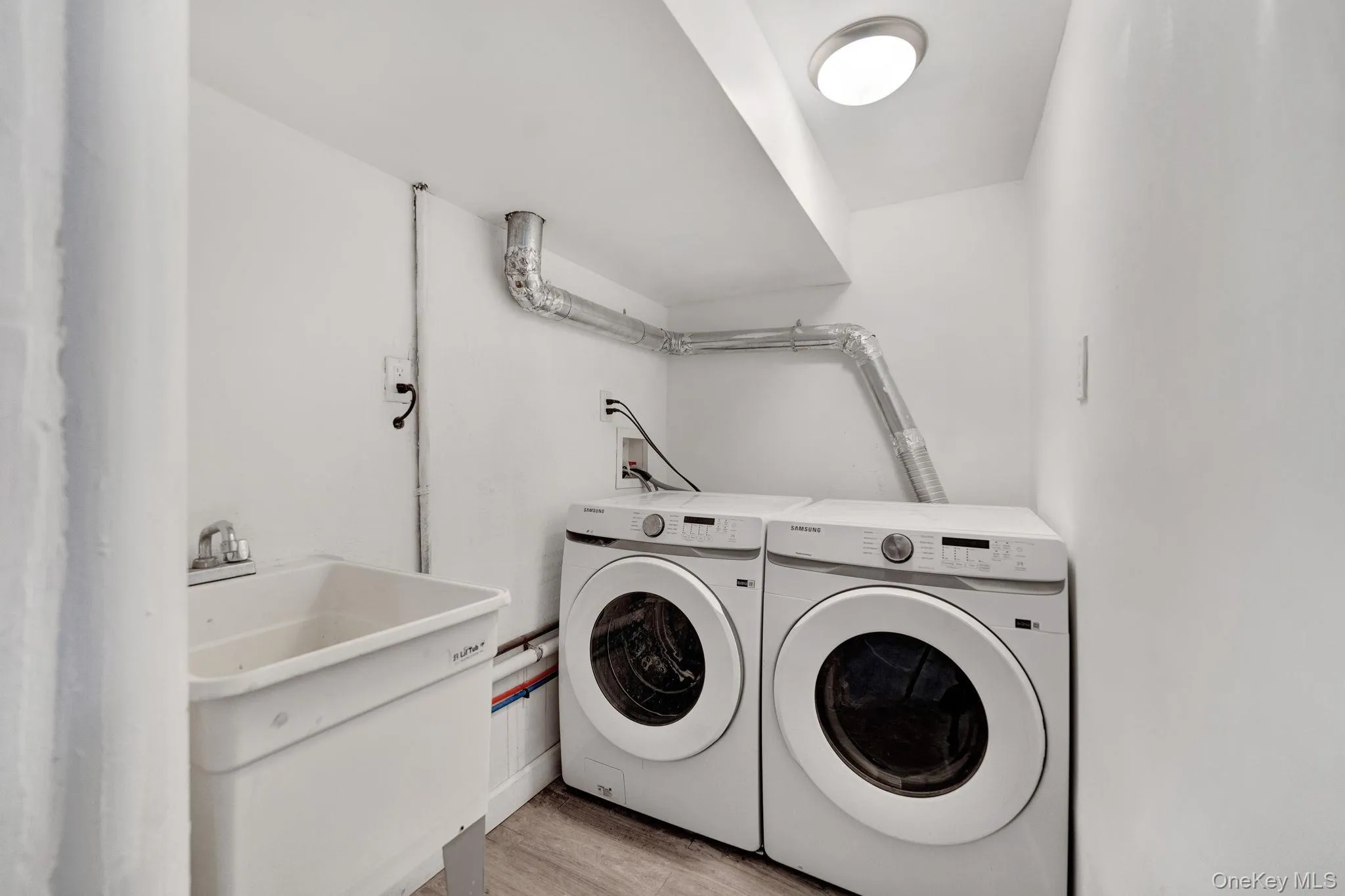 Laundry room in basement. Laundry room in basement.
