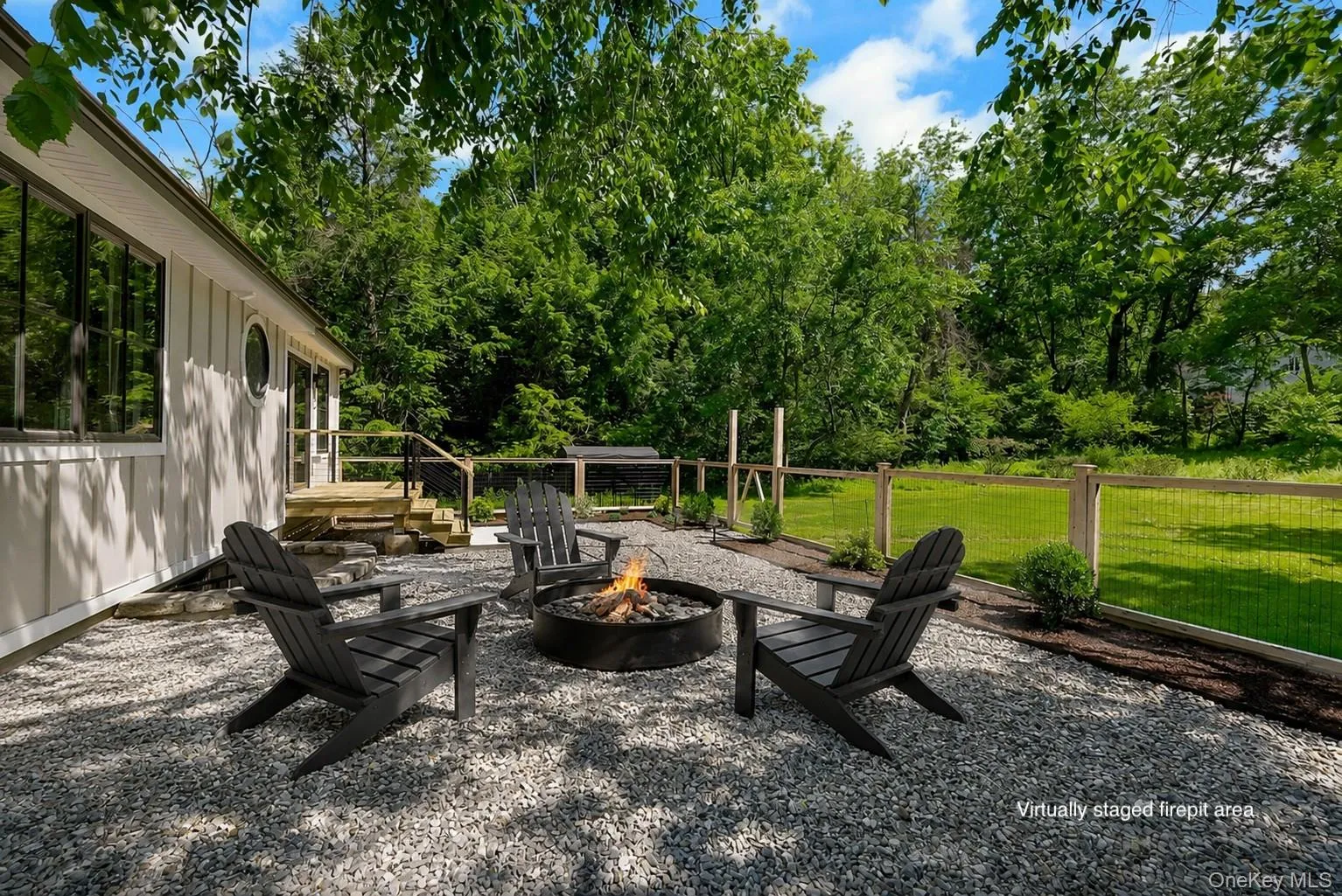 Virtually staged chairs and fire pit. Virtually staged chairs and fire pit.