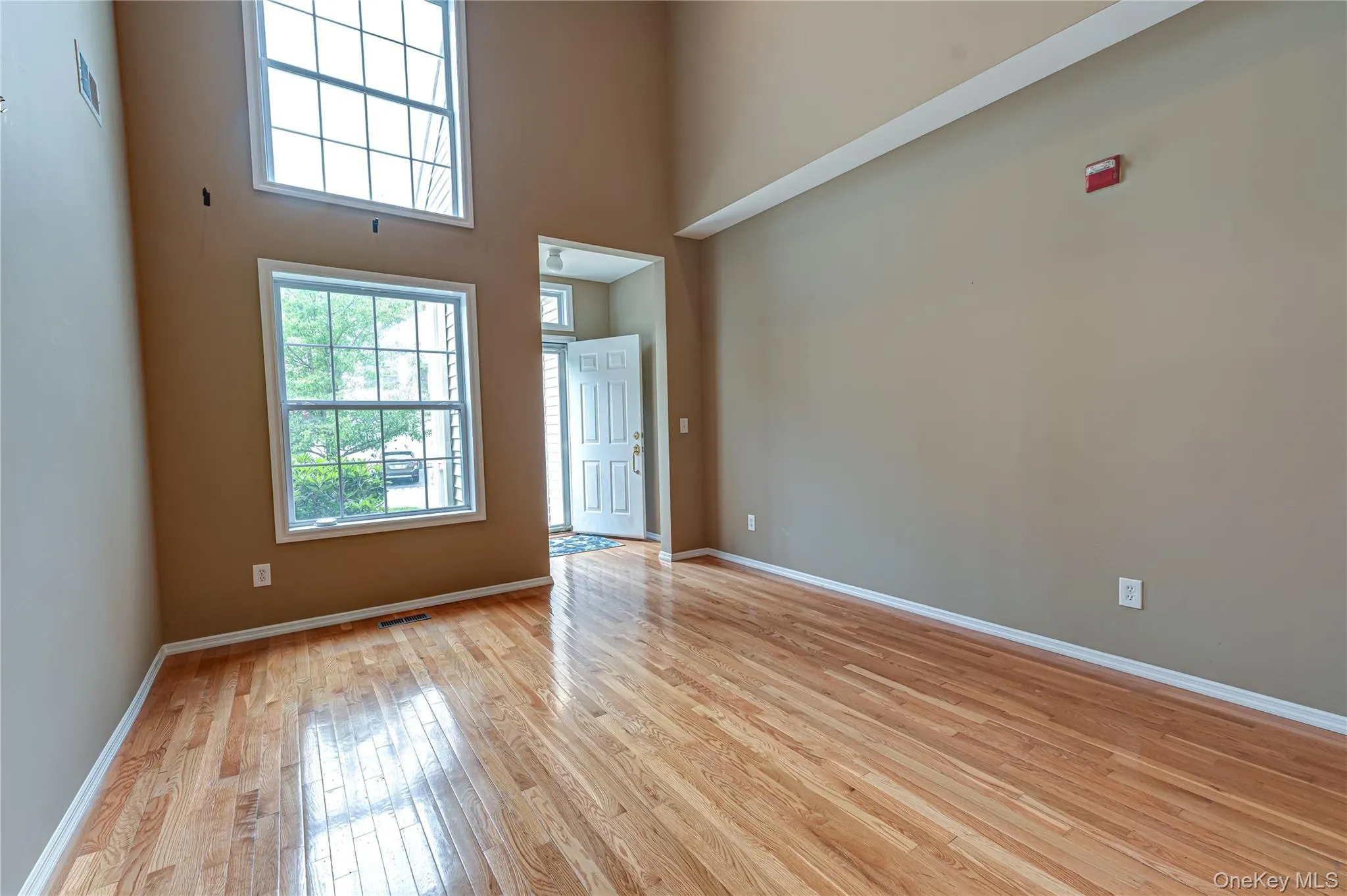 Bright Open Living Room with Cathedral Ceilings and hardwood flooring Bright Open Living Room with Cathedral Ceilings and hardwood flooring