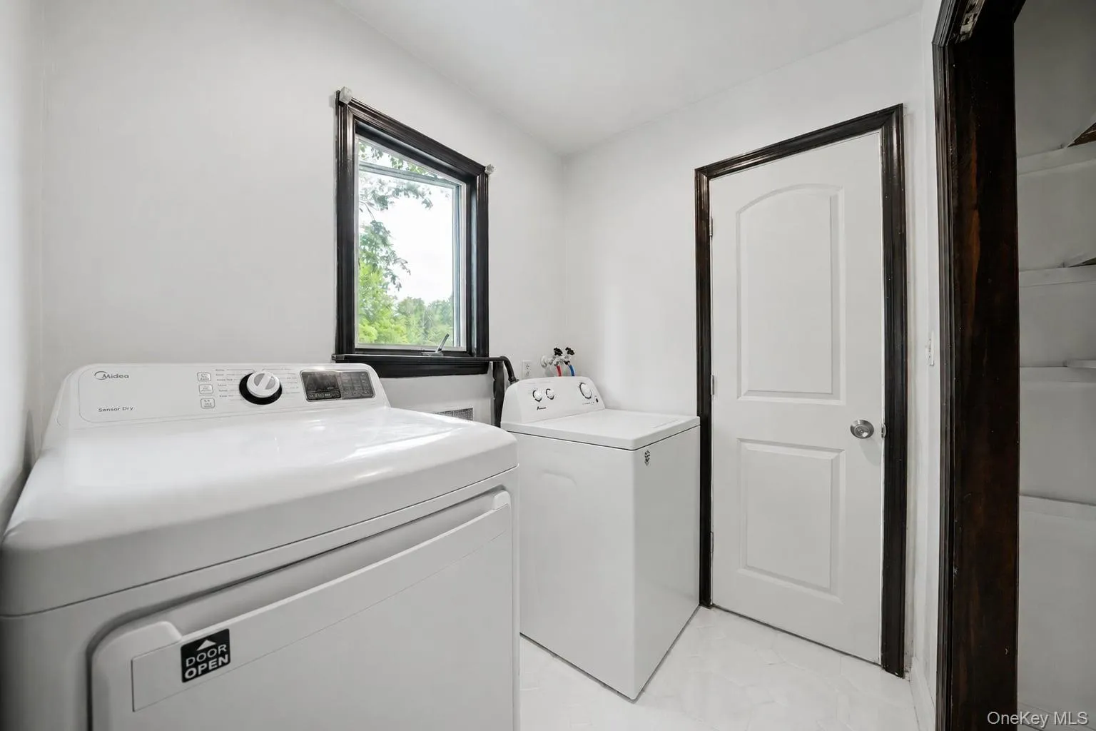 Convenient laundry area offering practical space for everyday routines, with easy access and added functionality for the home. Convenient laundry area offering practical space for everyday routines, with easy access and added functionality for the home.