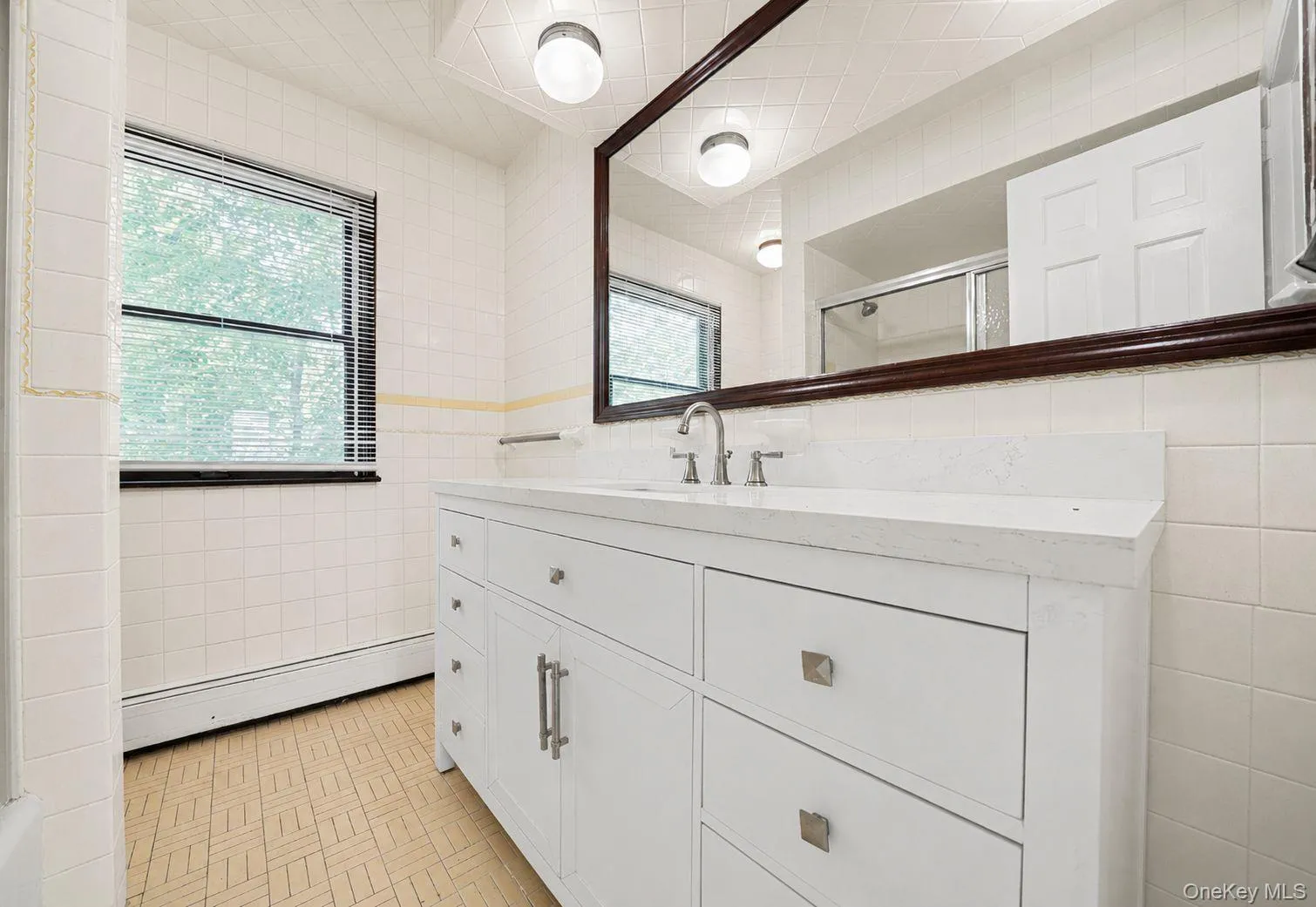 Full bathroom conveniently located near the additional bedrooms, offering a practical layout for daily routines. Full bathroom conveniently located near the additional bedrooms, offering a practical layout for daily routines.