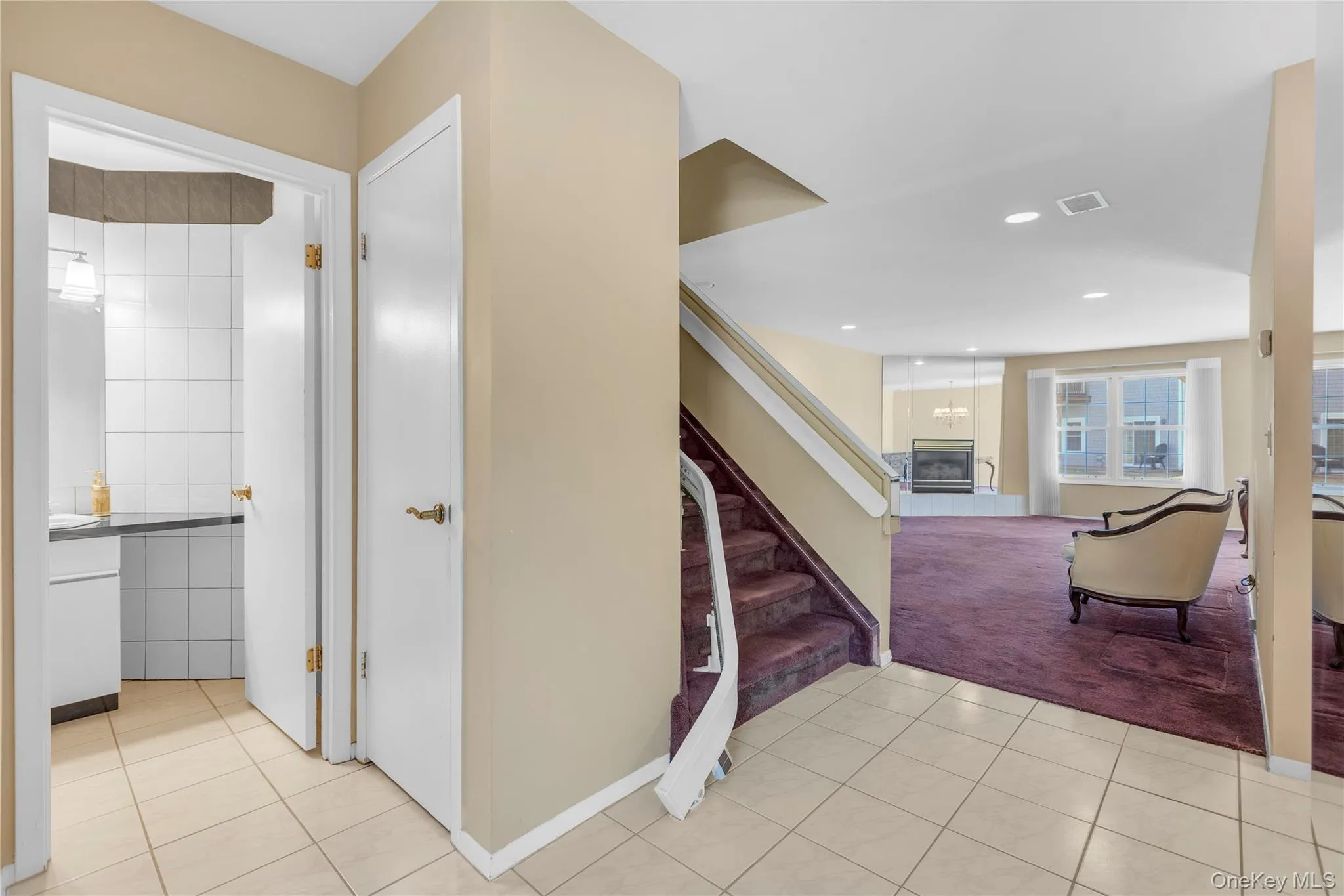 Staircase with chair lift to second floor Staircase with chair lift to second floor