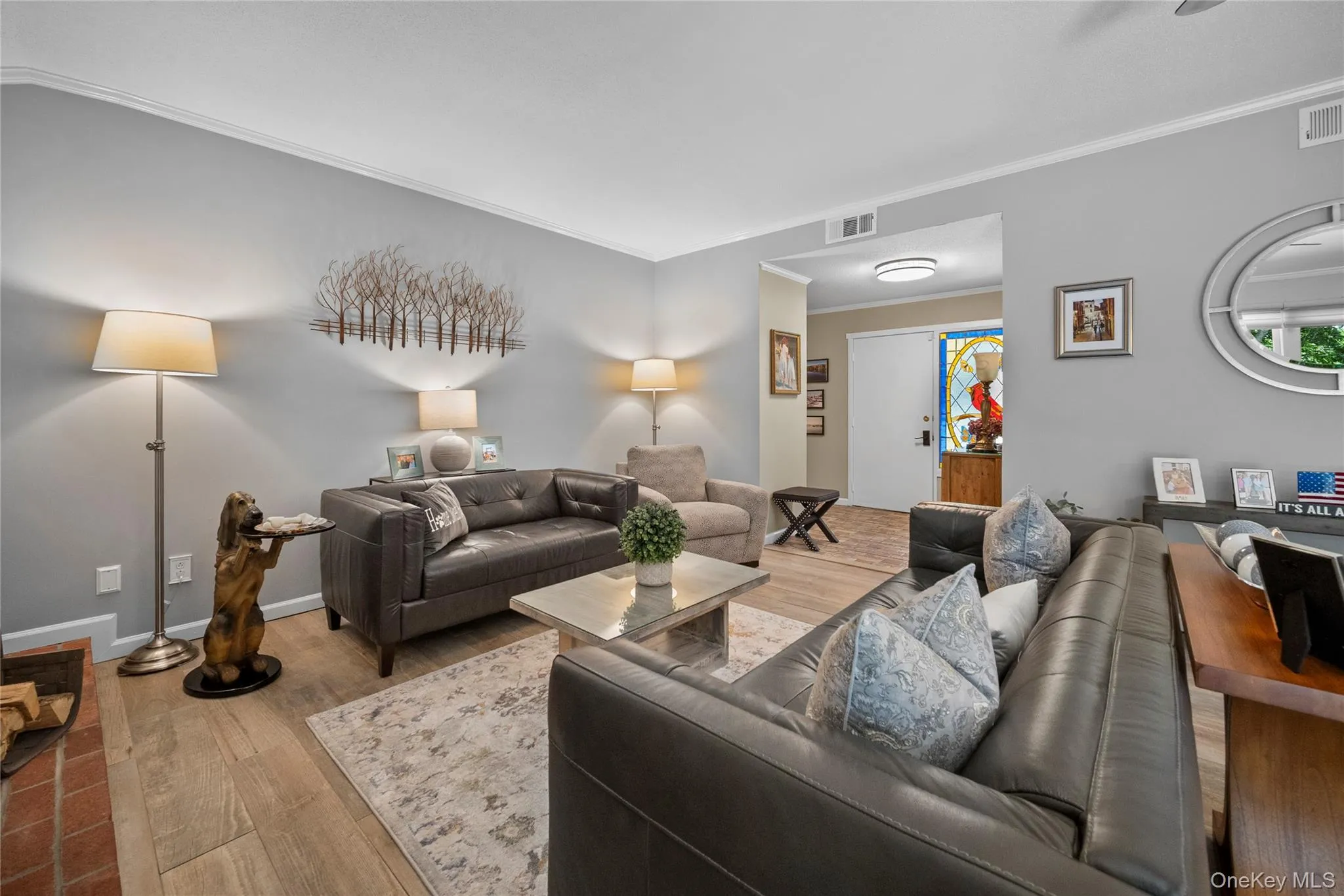 Open concept living area featuring light gray walls, ceramic flooring, a white trim package, and recessed lighting Open concept living area featuring light gray walls, ceramic flooring, a white trim package, and recessed lighting
