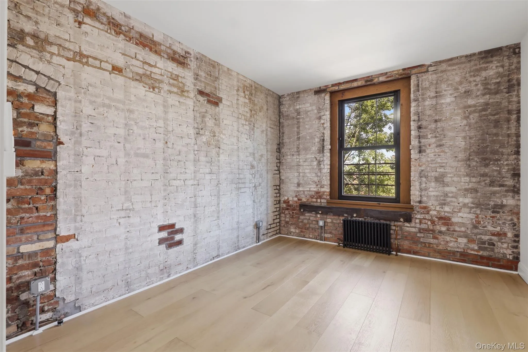 Bedroom with Exposed Brick, Large Closet + Mini-Split Bedroom with Exposed Brick, Large Closet + Mini-Split