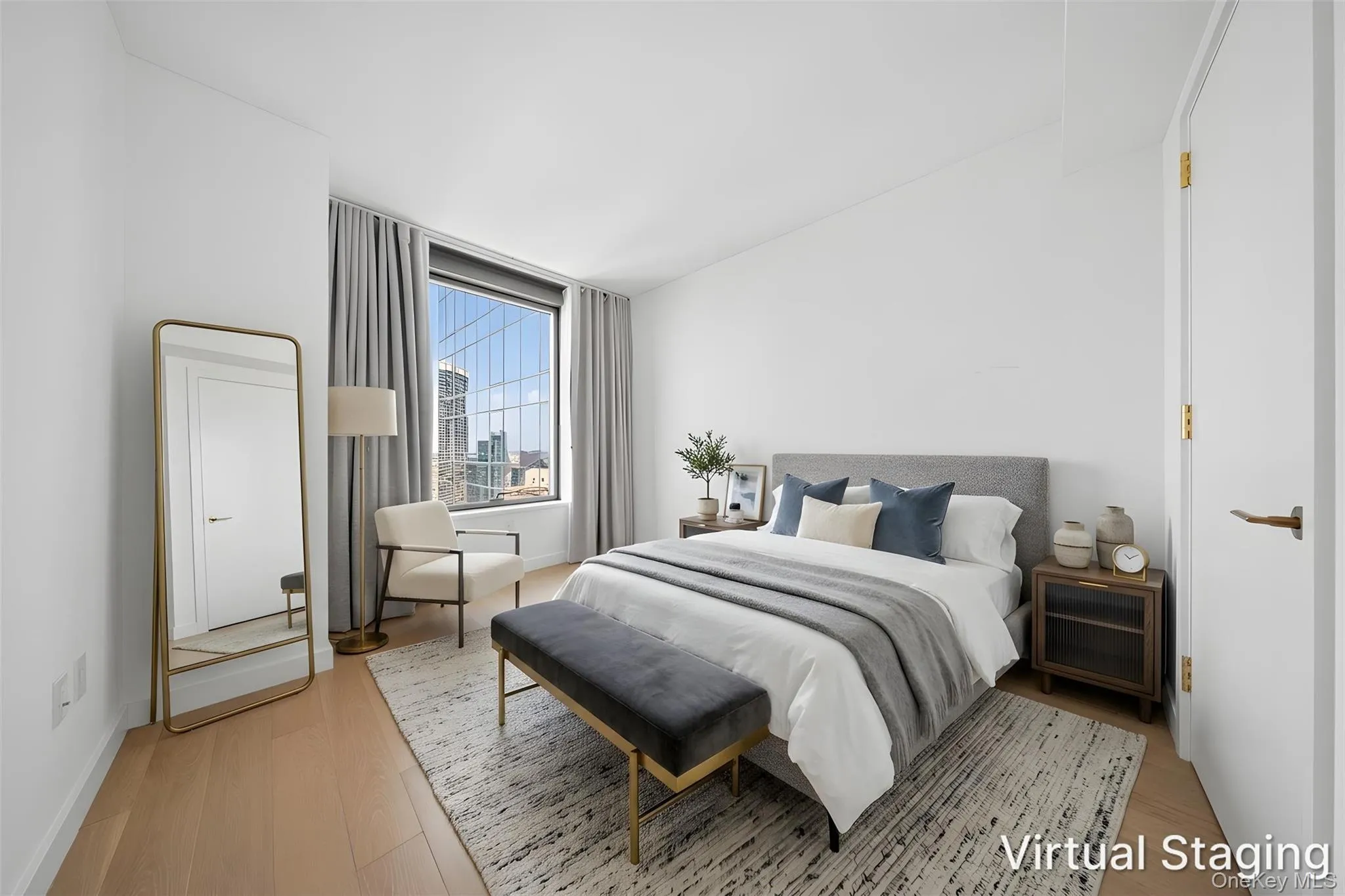 Bedroom featuring expansive window, light wood-finish flooring, and crisp white walls Bedroom featuring expansive window, light wood-finish flooring, and crisp white walls