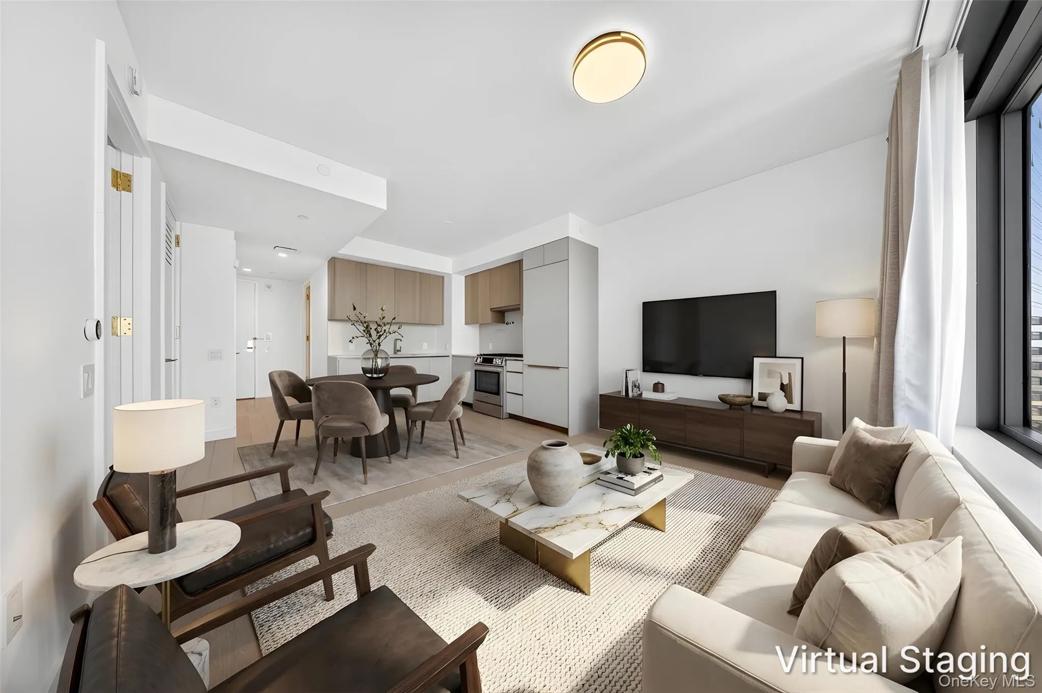 Open-concept living space featuring wood-finish flooring, a contemporary kitchen with light wood-finish cabinetry, and a dining area Open-concept living space featuring wood-finish flooring, a contemporary kitchen with light wood-finish cabinetry, and a dining area