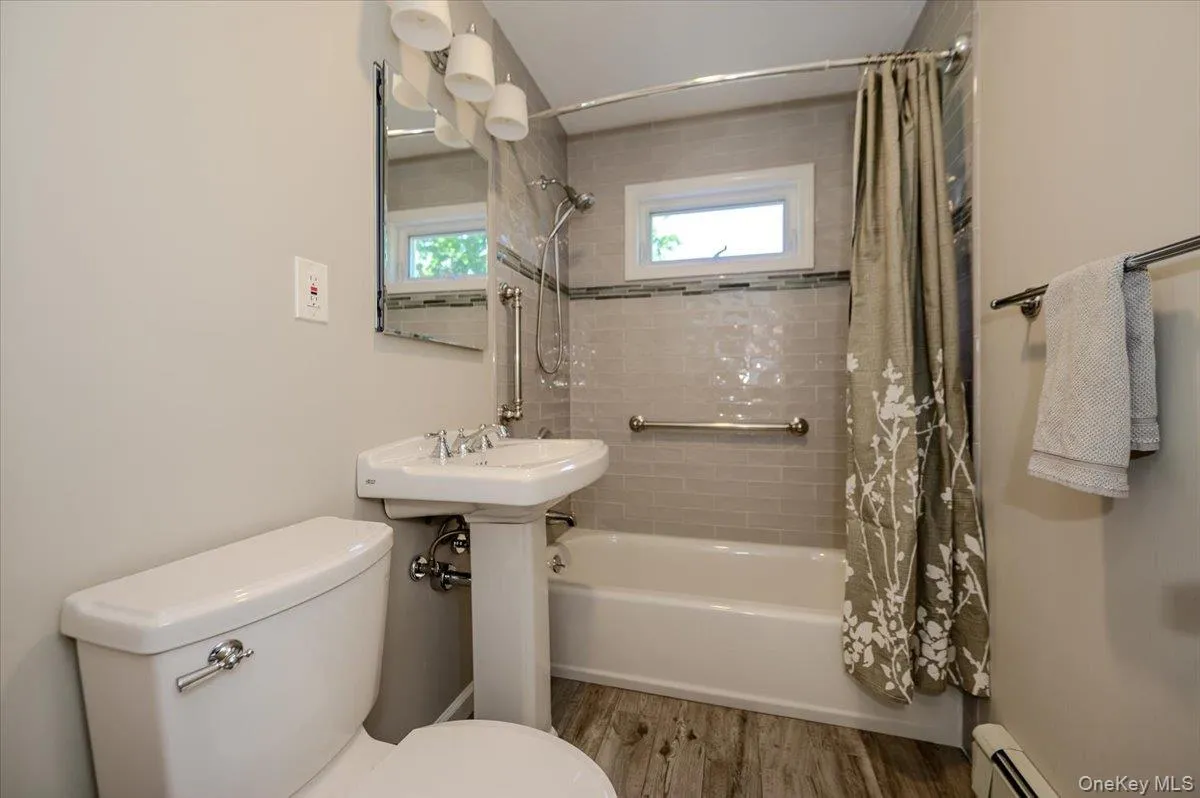 New renovated full bathroom located on the second level. Tile flooring and tile surrounding tub and shower combination. New renovated full bathroom located on the second level. Tile flooring and tile surrounding tub and shower combination.