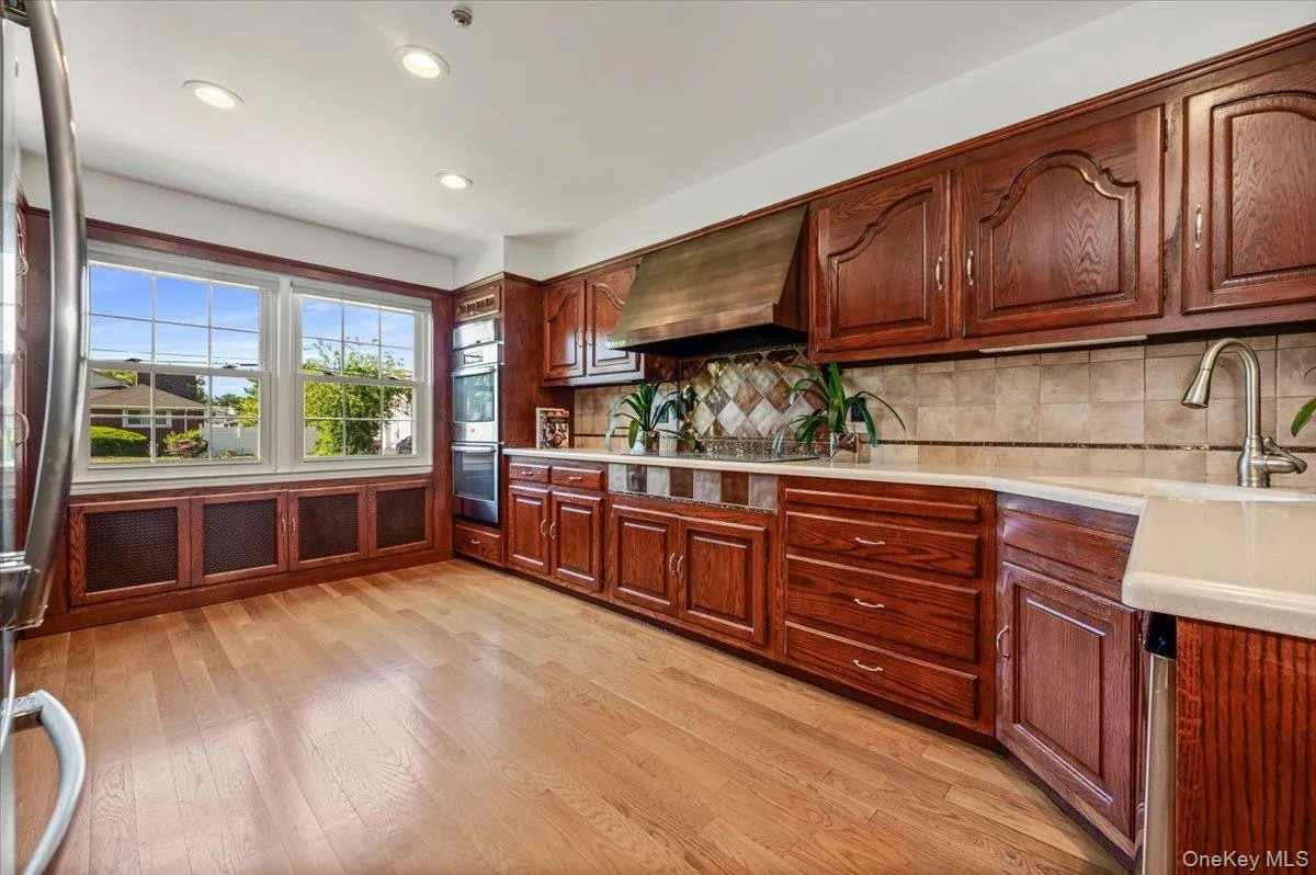 Large workspace with plenty of couter space, copper hood vent and large window to let in plenty of natural light. Large workspace with plenty of couter space, copper hood vent and large window to let in plenty of natural light.