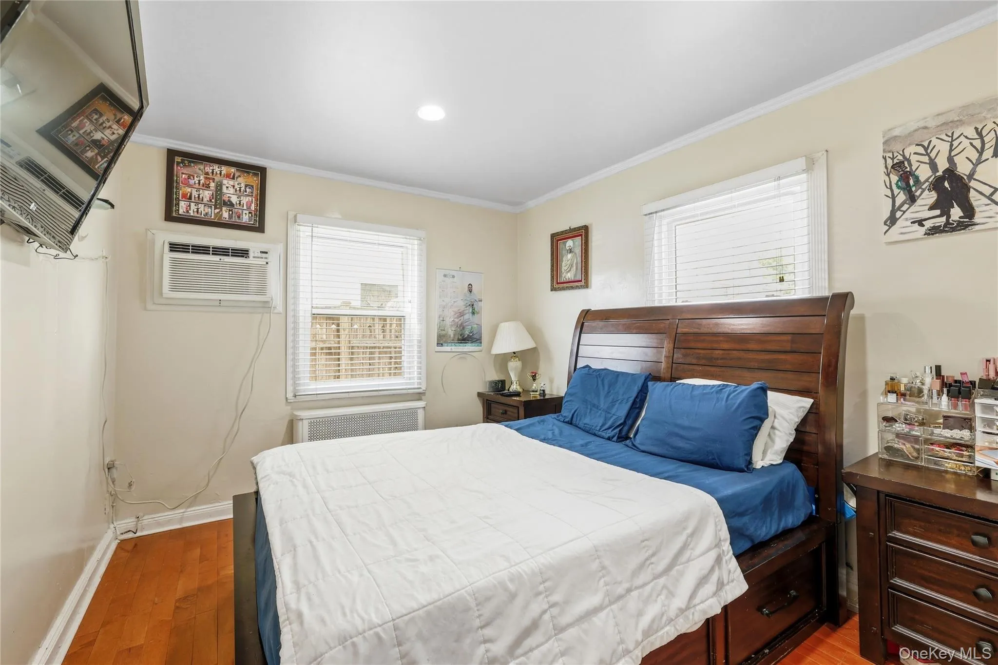 Wood-finish flooring and light-toned walls create a neutral backdrop for the room Wood-finish flooring and light-toned walls create a neutral backdrop for the room