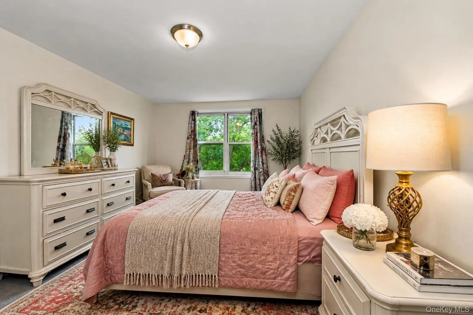 Spacious room featuring light-colored walls, a large window, a ceiling-mounted light fixture, and carpeted flooring. Virtually Enhanced. Spacious room featuring light-colored walls, a large window, a ceiling-mounted light fixture, and carpeted flooring. Virtually Enhanced.