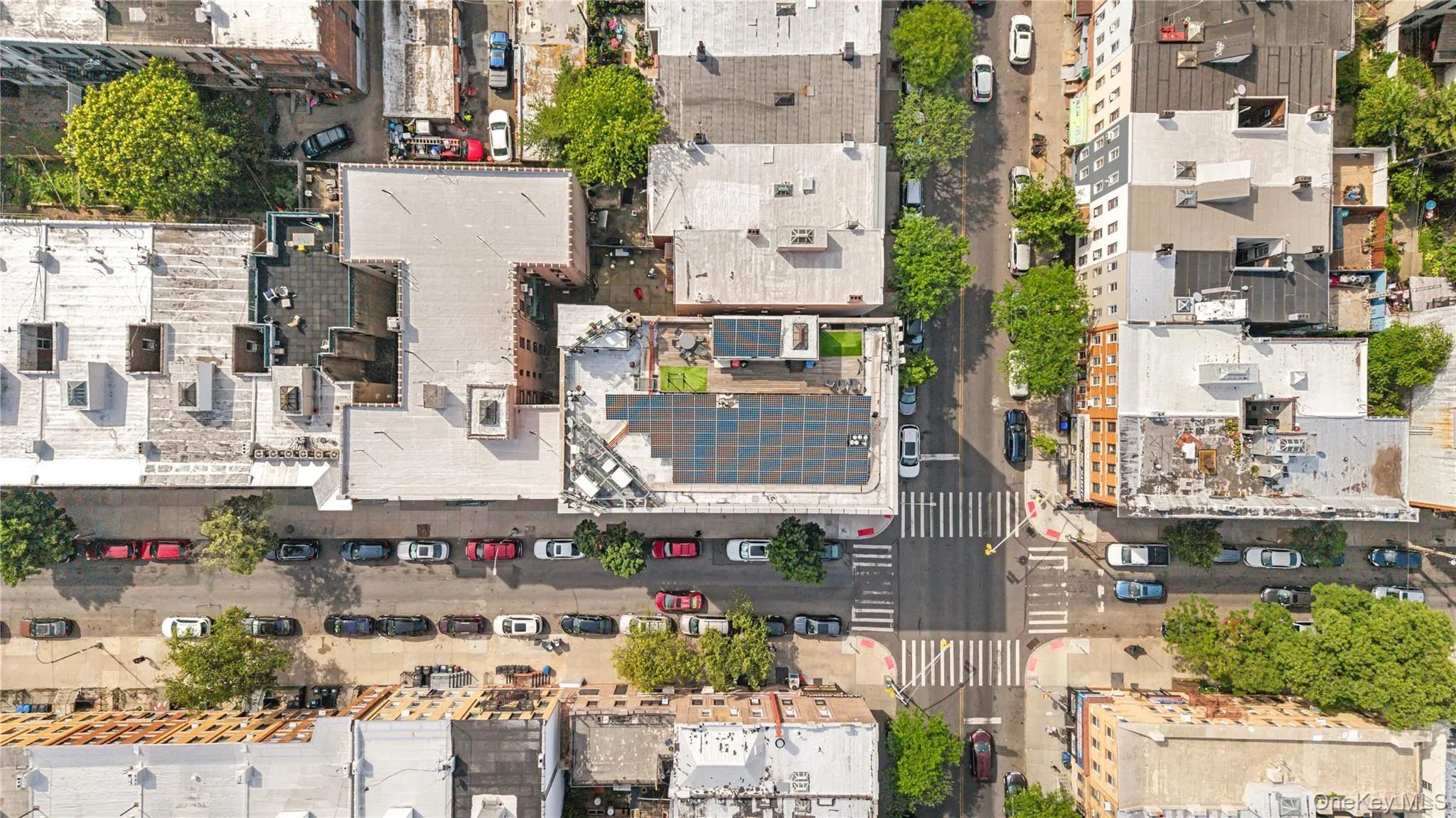 Rooftop solar panel array, flat roof design, and green roof sections Rooftop solar panel array, flat roof design, and green roof sections