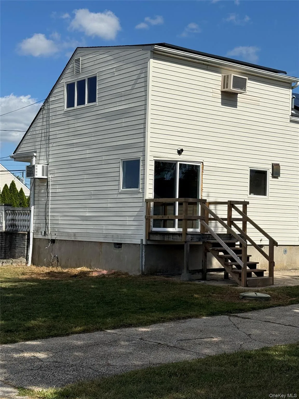 View of corner back of house with an outdoor structure View of corner back of house with an outdoor structure