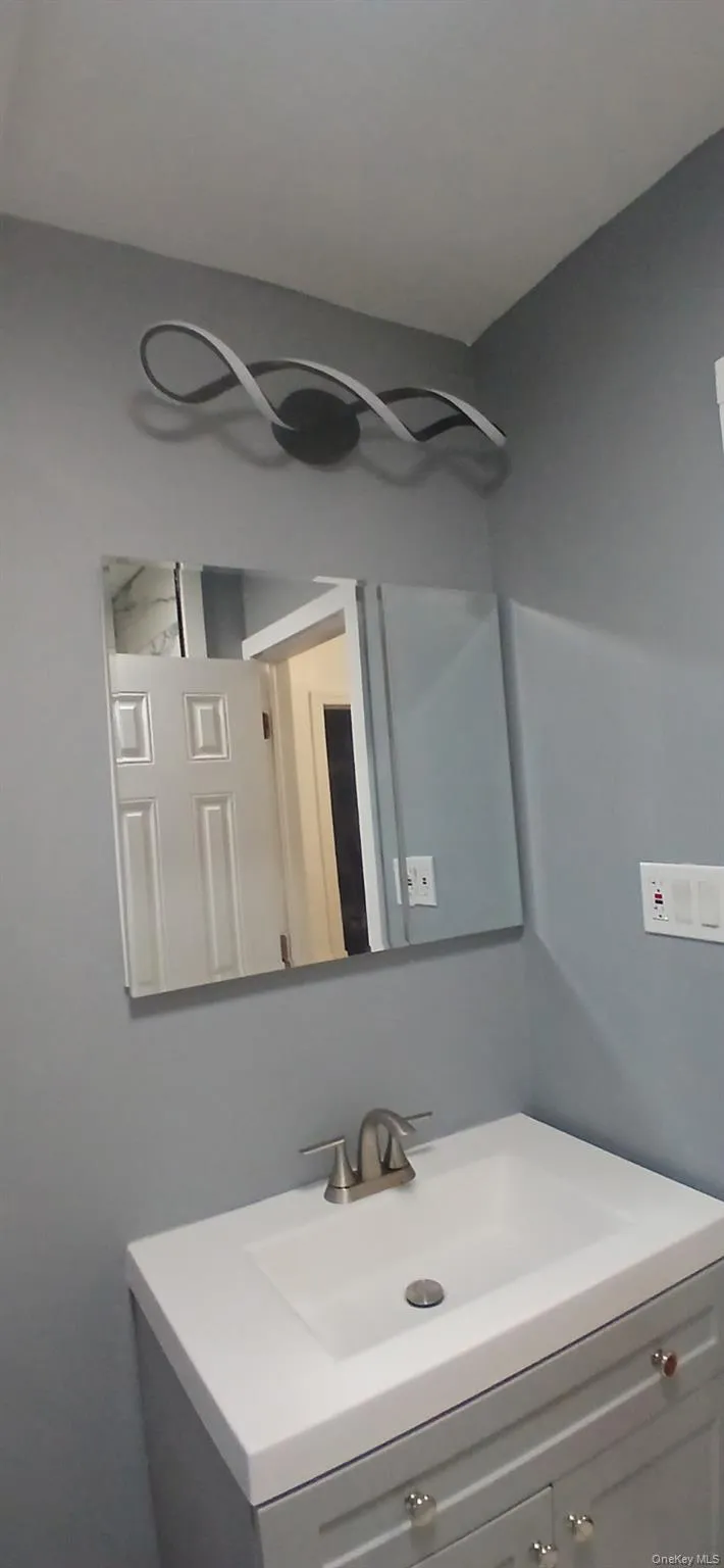 Bathroom featuring vanity Bathroom featuring vanity