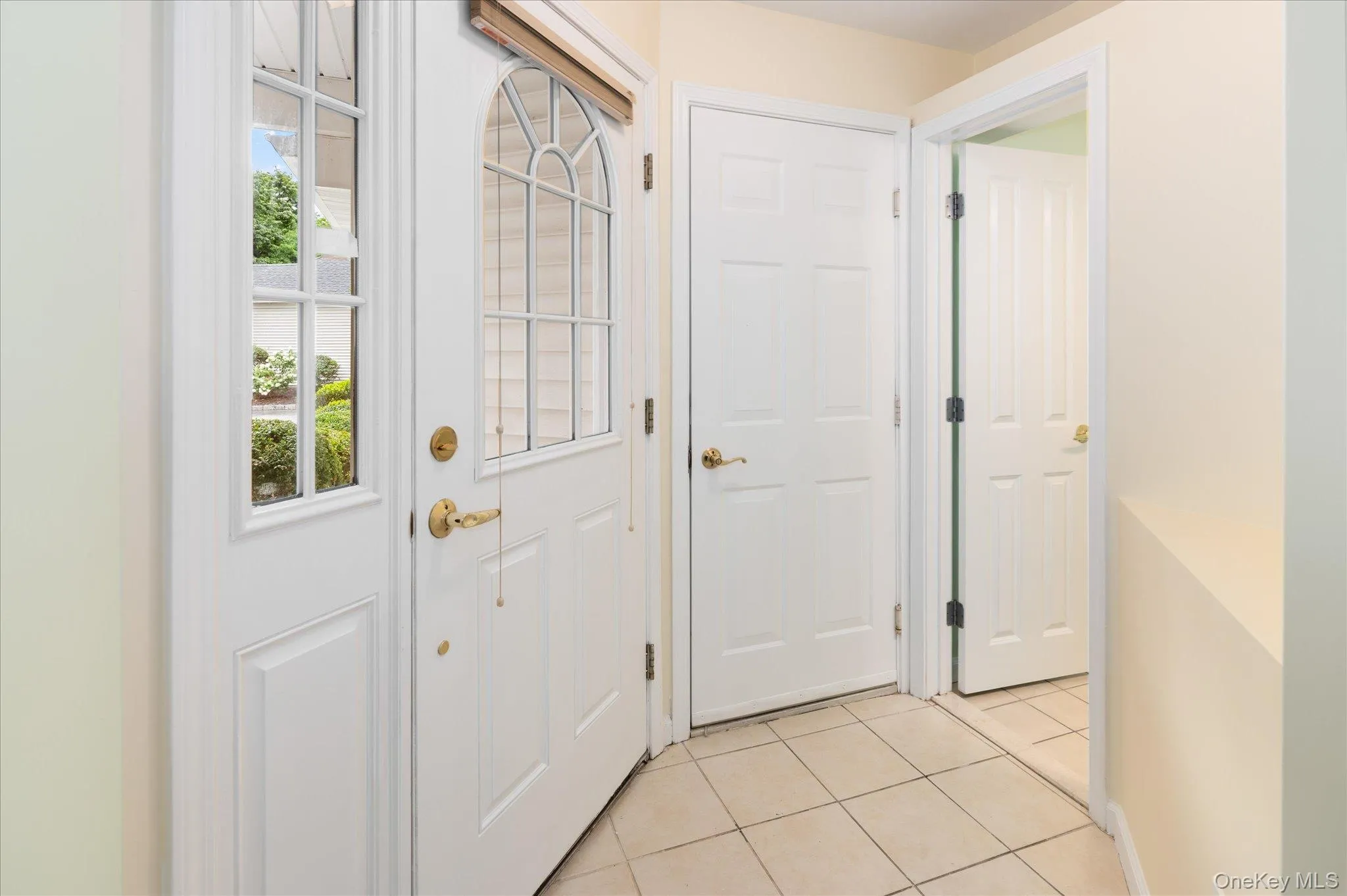 Entryway showing door leading to attached garage Entryway showing door leading to attached garage