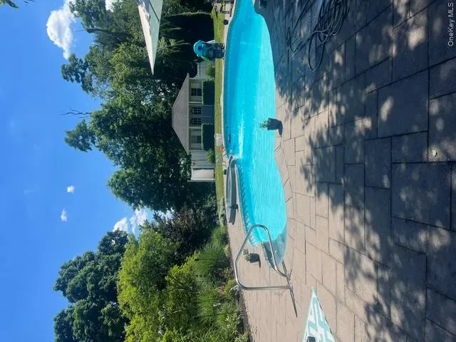 incredible in-ground pool heated by hot tub flowing into it incredible in-ground pool heated by hot tub flowing into it