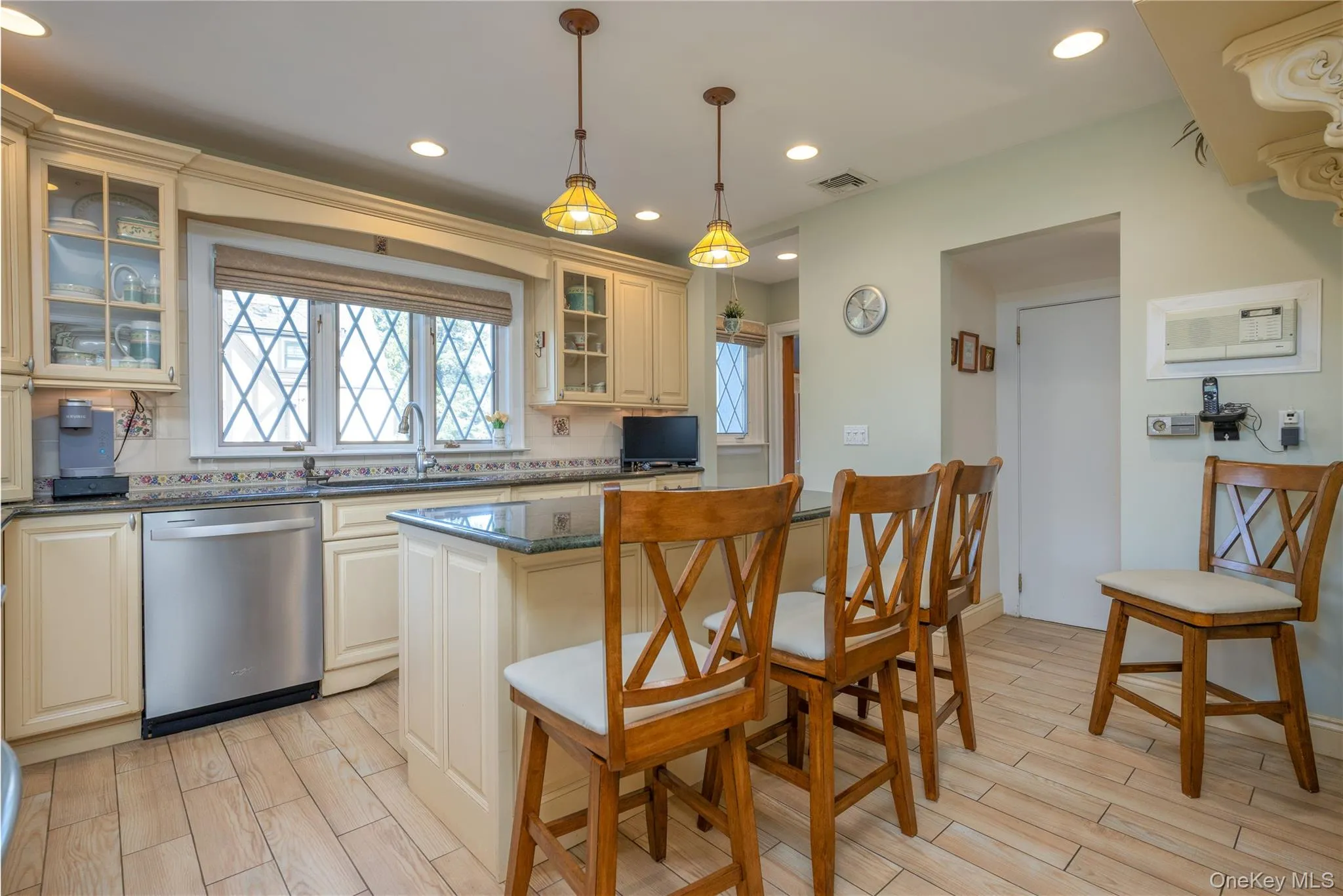 Renovated Chef's kitchen with pendant lights, island seating, stainless applicances Renovated Chef's kitchen with pendant lights, island seating, stainless applicances