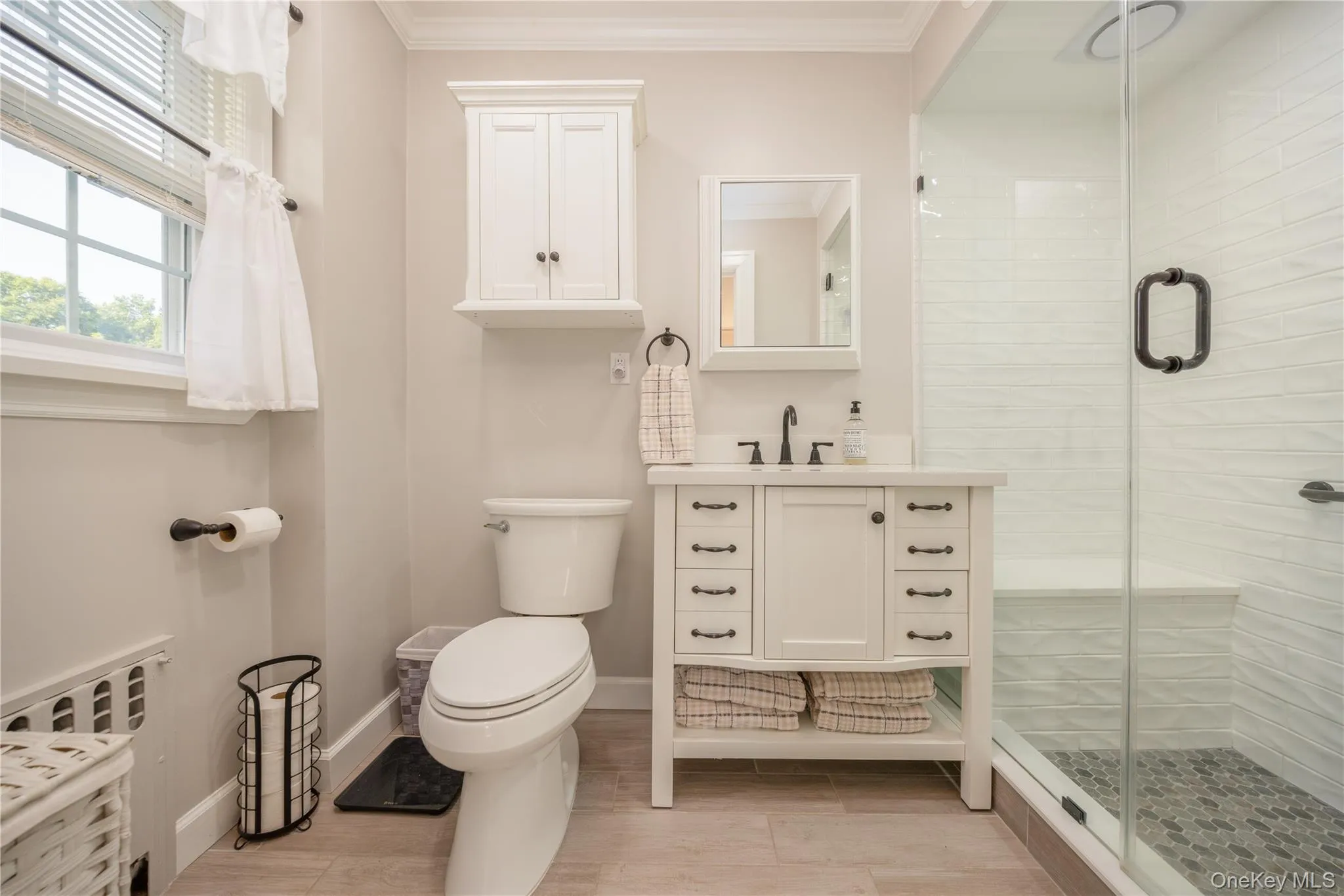 Newly remodeled primary bathroom with walk-in shower Newly remodeled primary bathroom with walk-in shower