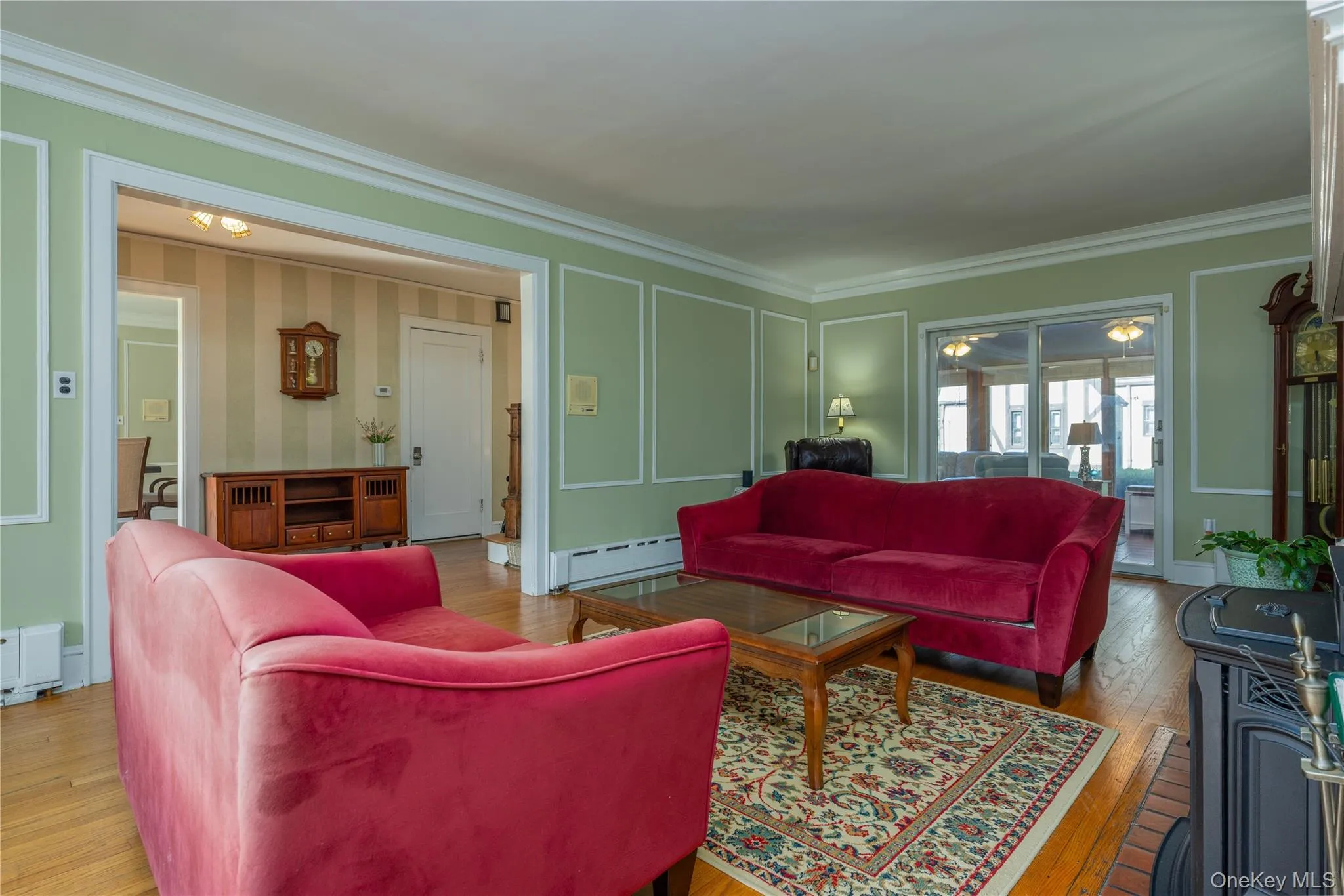 Spacious living room with case opening to the front hall Spacious living room with case opening to the front hall