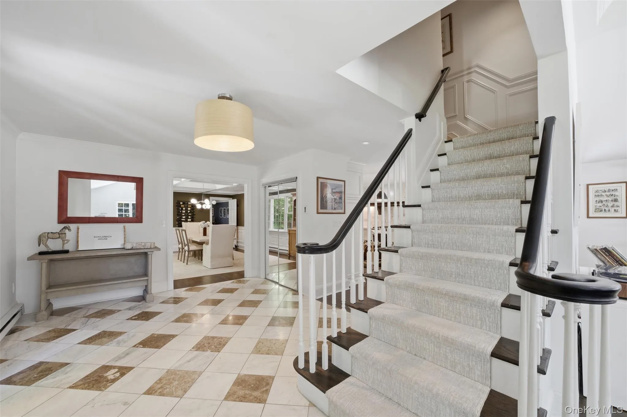 Spacious entry foyer welcomes you in adorned with stylish millwork Spacious entry foyer welcomes you in adorned with stylish millwork