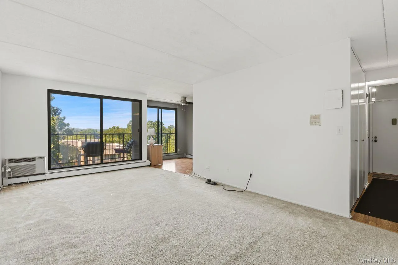 Freshly painted living with oversized glass sliding doors to a breathtaking panorama views. Freshly painted living with oversized glass sliding doors to a breathtaking panorama views.
