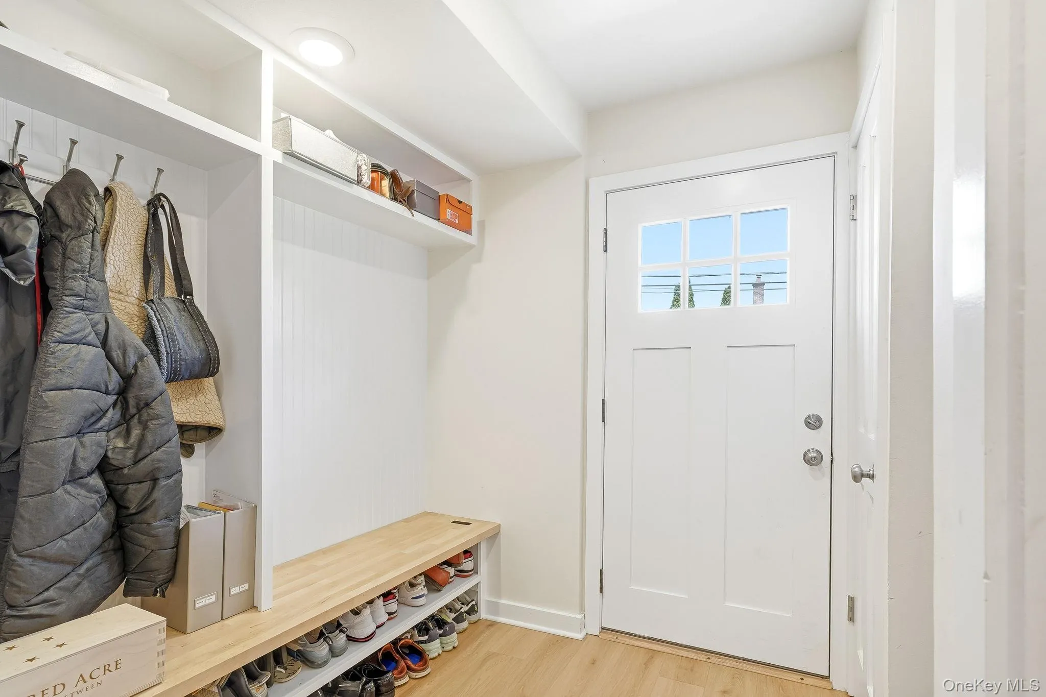 New Mudroom with Custom Bench/Shelving with Access to Attached Garage New Mudroom with Custom Bench/Shelving with Access to Attached Garage