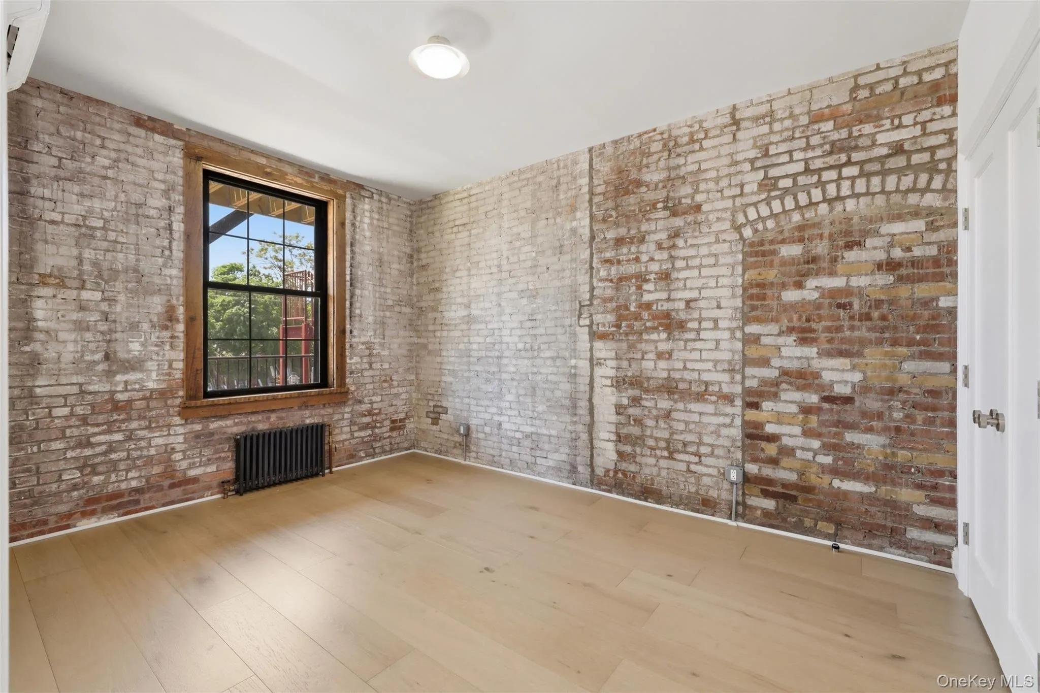 Spacious Bedroom with Exposed Brick and 2 Double Closets Spacious Bedroom with Exposed Brick and 2 Double Closets