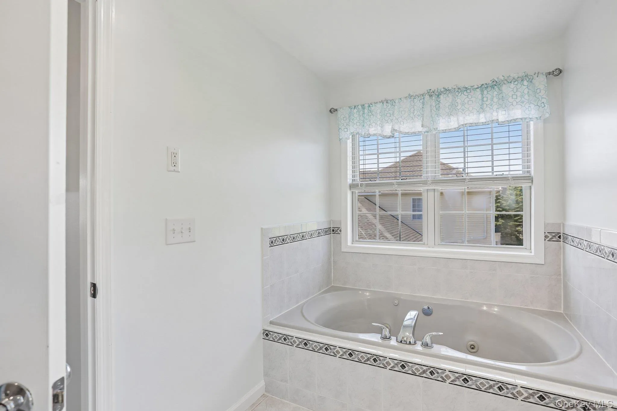 Primary bathroom offering whirlpool tub. Primary bathroom offering whirlpool tub.