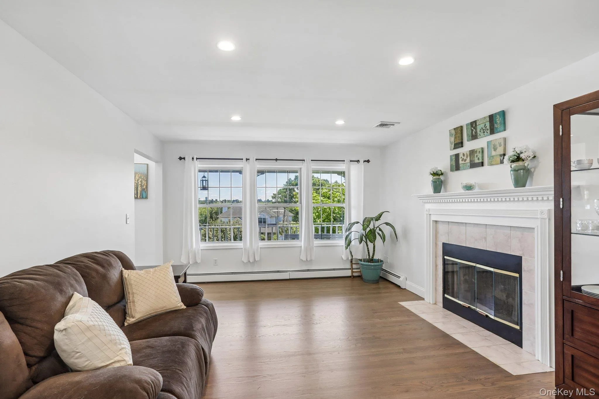 Formal living room with fireplace and hardwood floors. Formal living room with fireplace and hardwood floors.