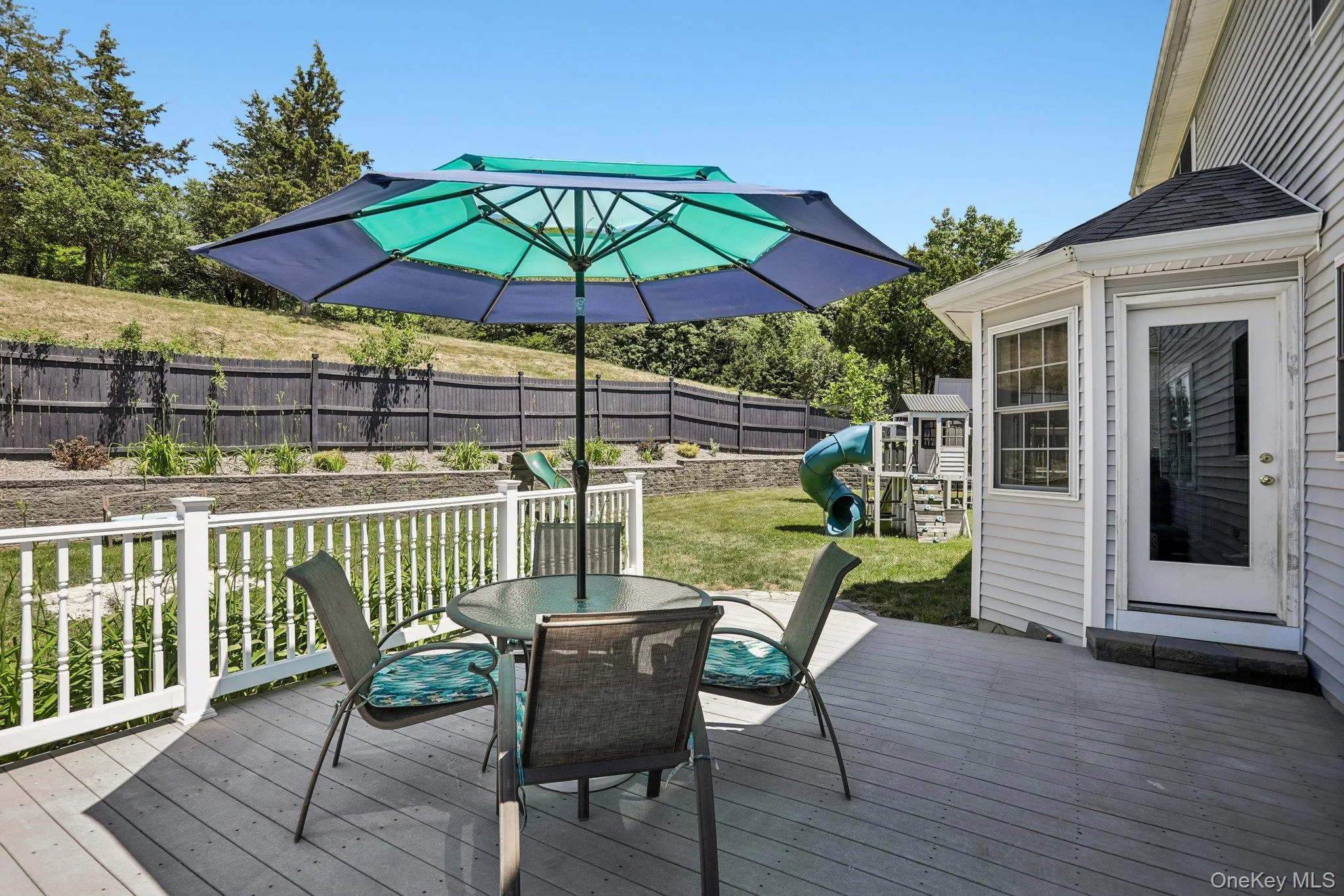 Composite decking with access to private yard. Composite decking with access to private yard.