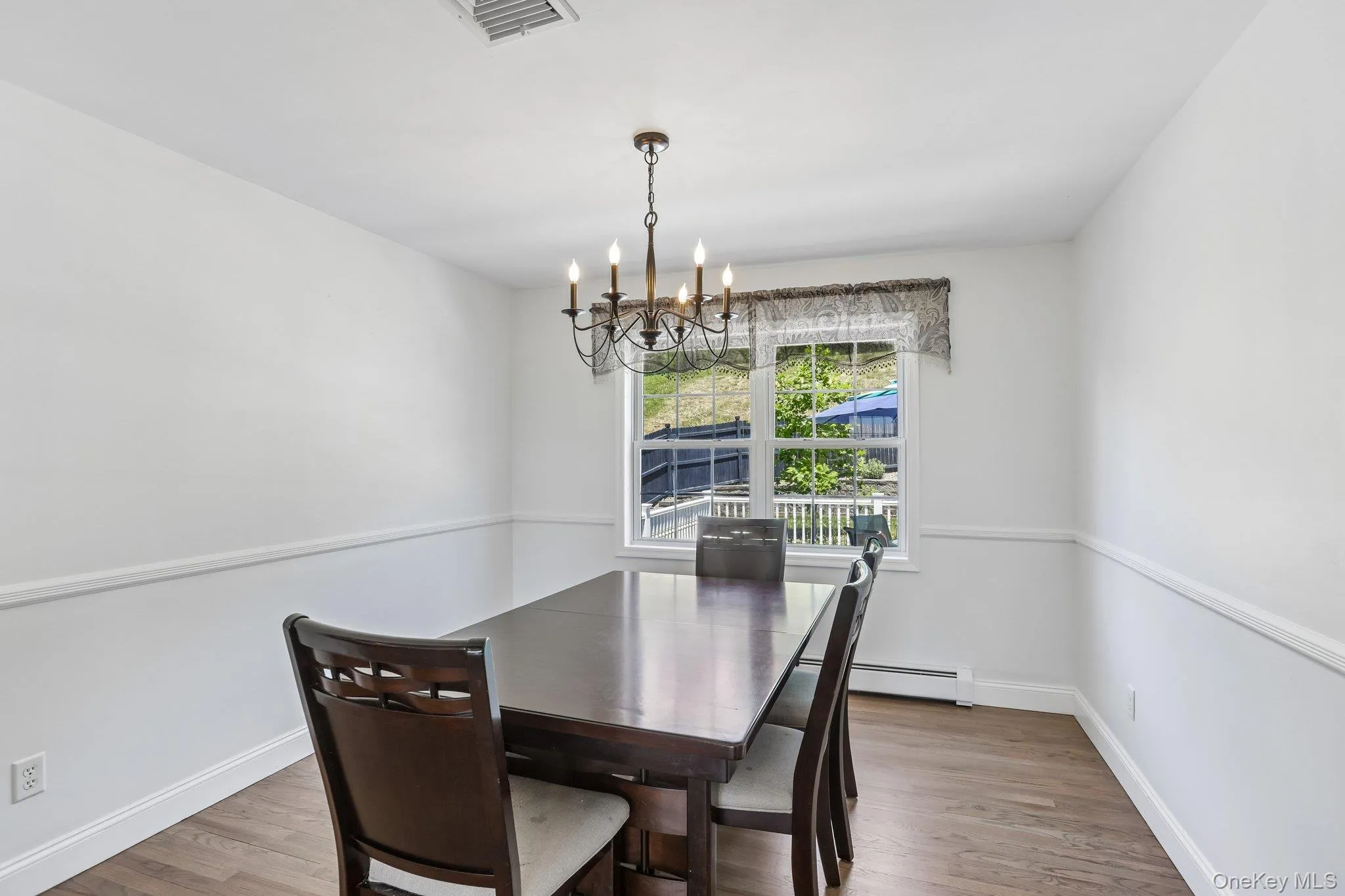 Formal dining room with hardwood floors. Formal dining room with hardwood floors.
