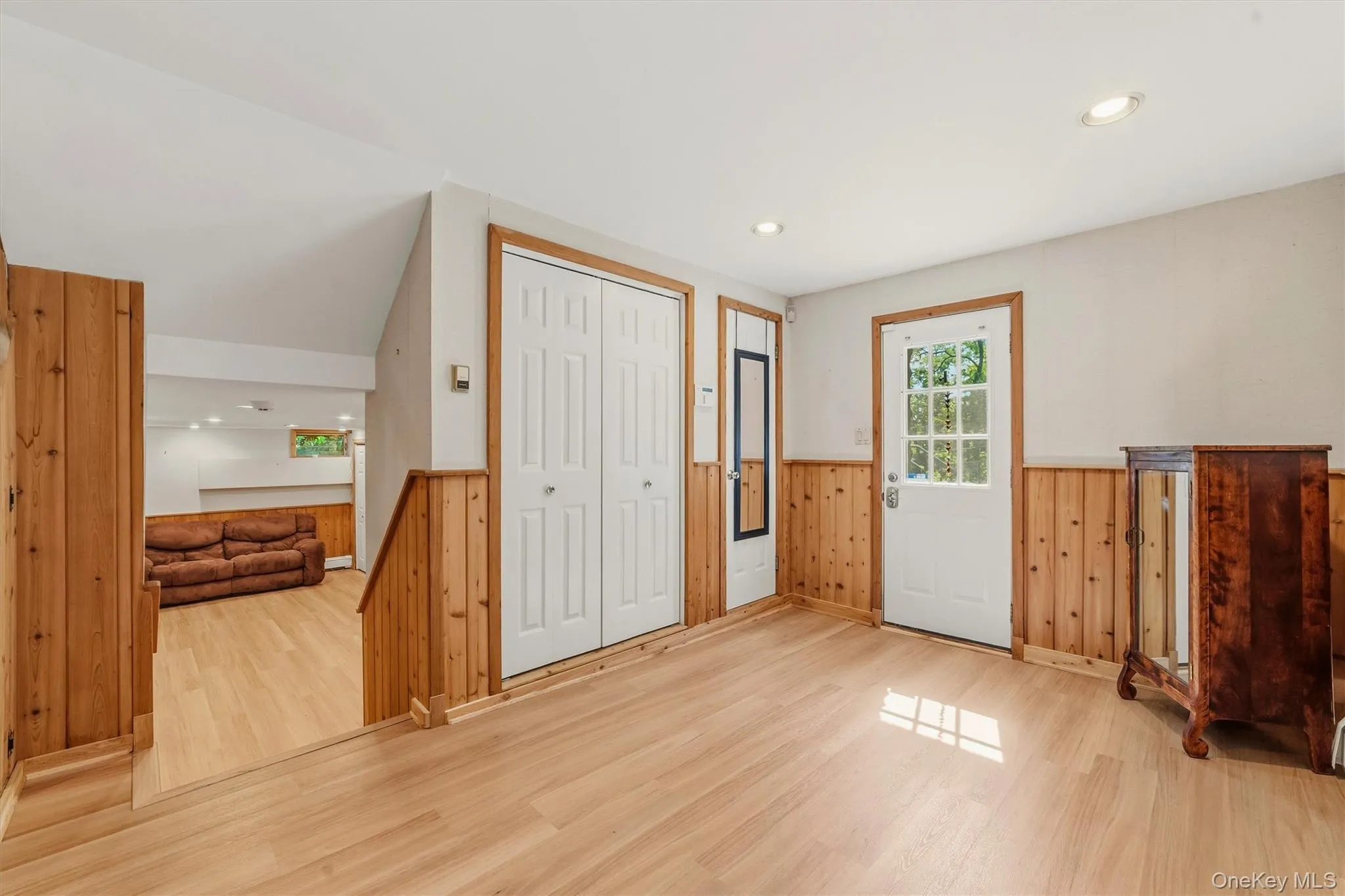 Mud room with lower level entry and access to garage Mud room with lower level entry and access to garage