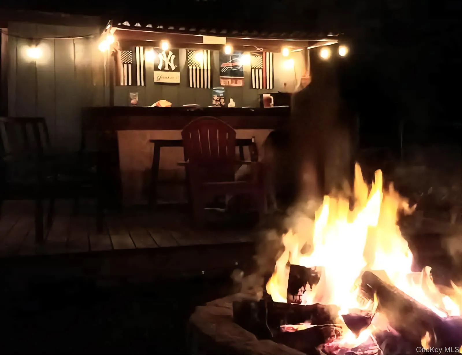 Outdoor Bar & Fire Pit at night Outdoor Bar & Fire Pit at night