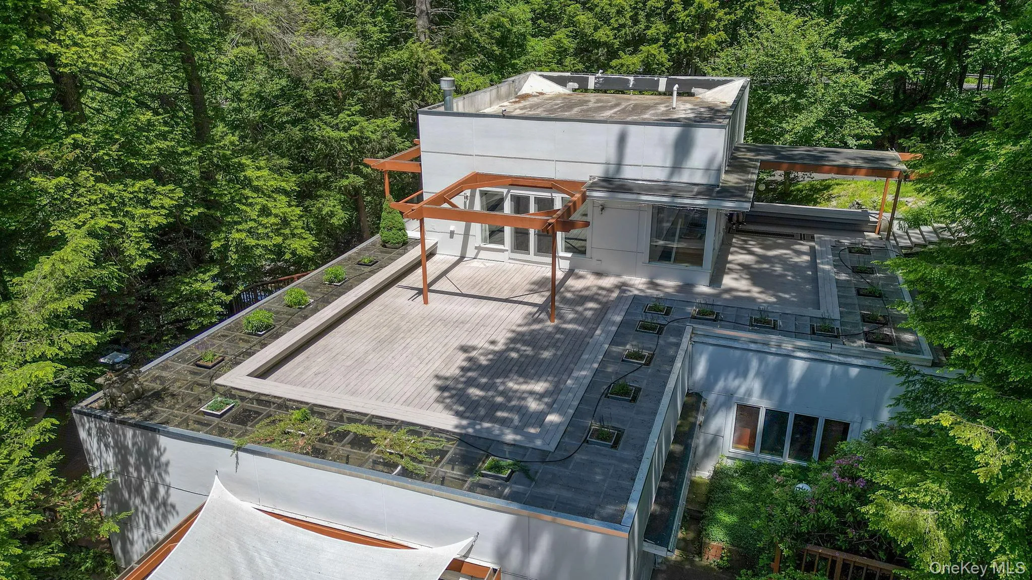 Drone view of the deck located off of the primary bedroom Drone view of the deck located off of the primary bedroom