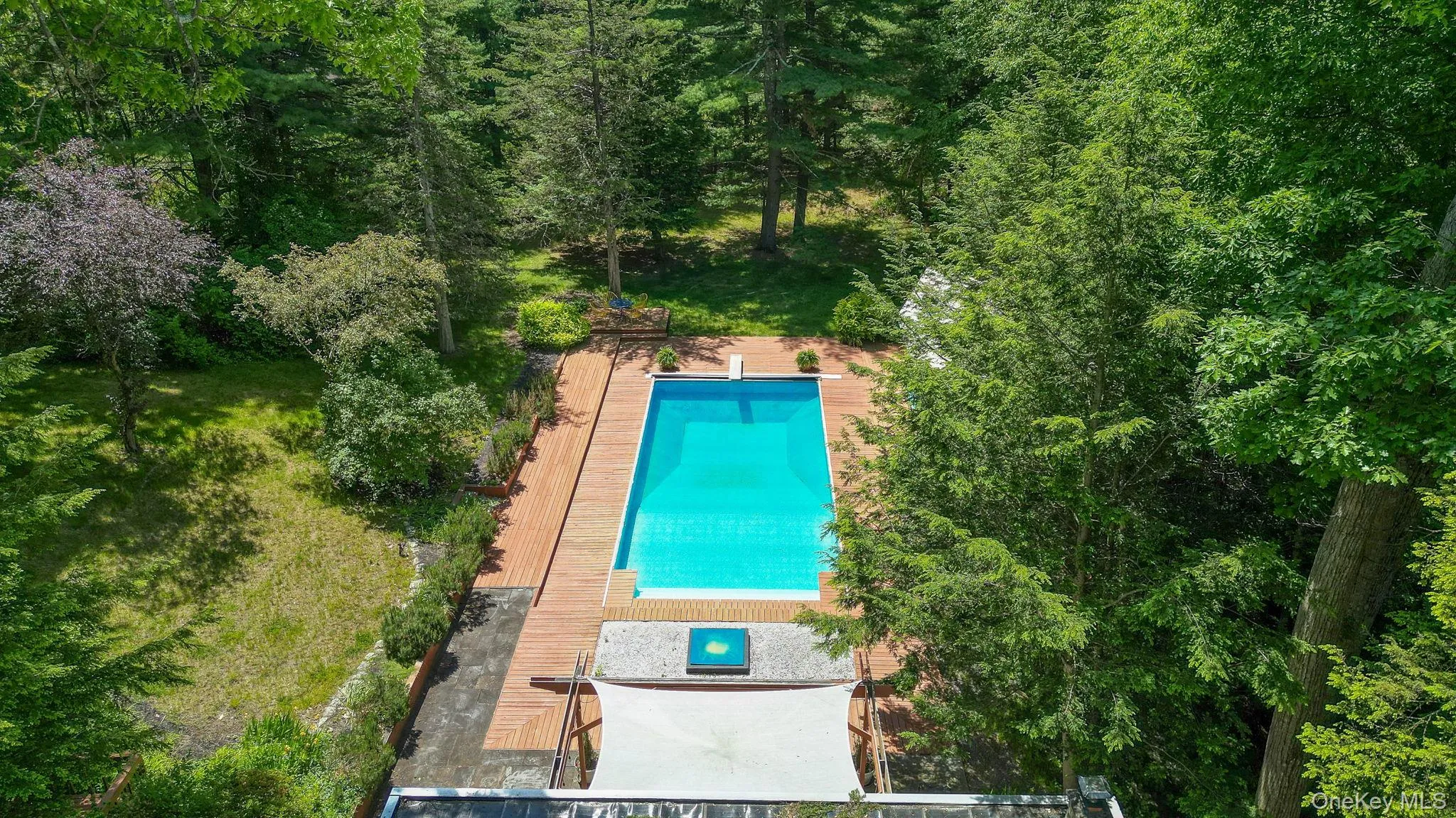 Drone view of the back yard and pool Drone view of the back yard and pool