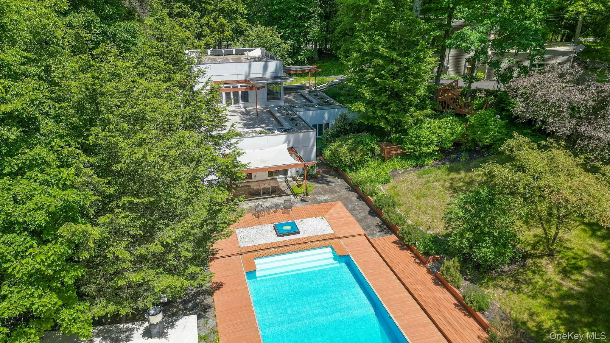 Drone view of the pool and main house Drone view of the pool and main house