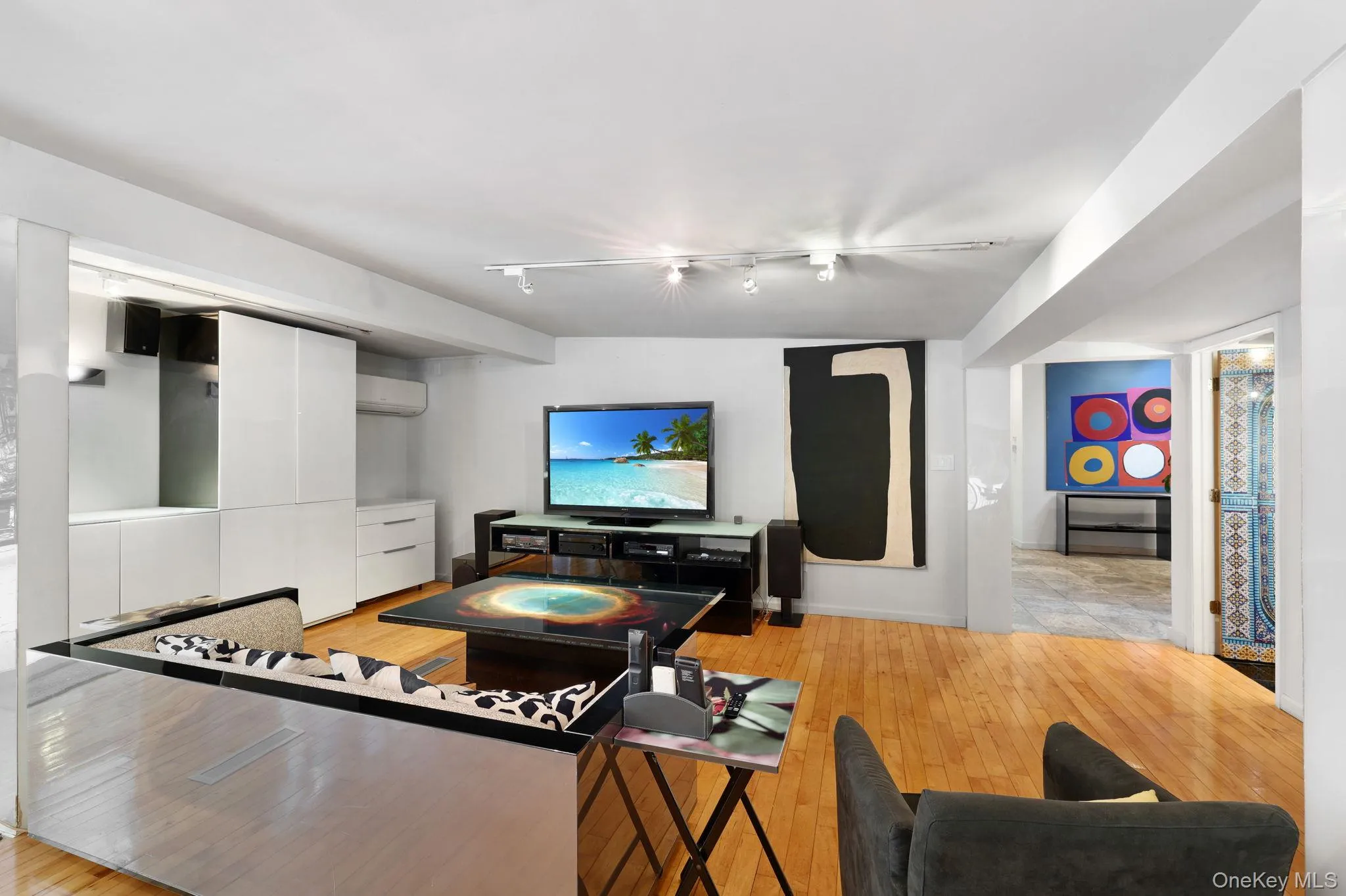Living room featuring an eletronically adjustable table Living room featuring an eletronically adjustable table